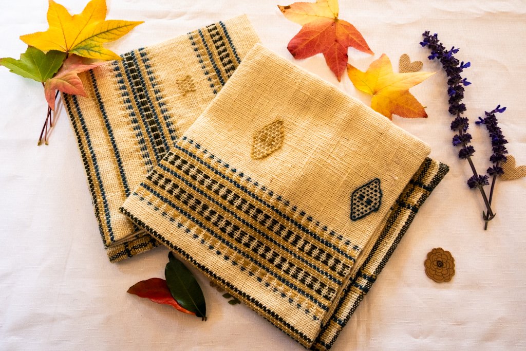 Handwoven Bhujodi Wool Cushion Cover – Natural Ivory with Indigo & Mustard Motifs