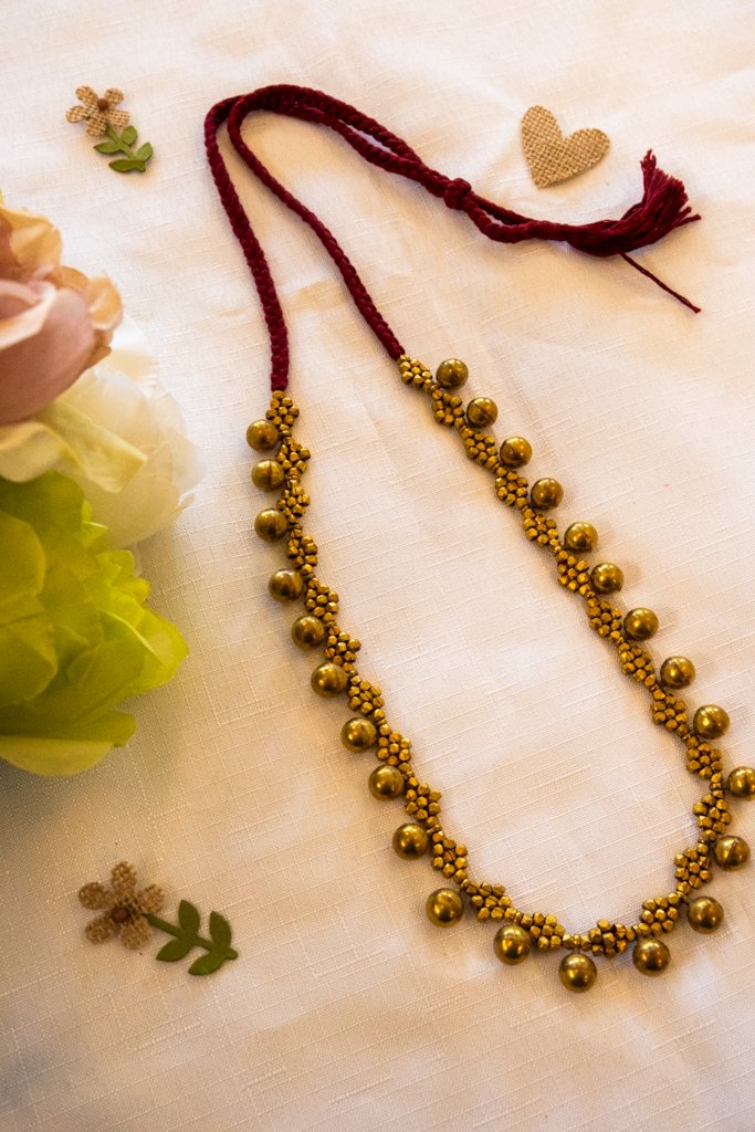 Handmade Dhokra Brass Ball Necklace – Woven Maroon Cord