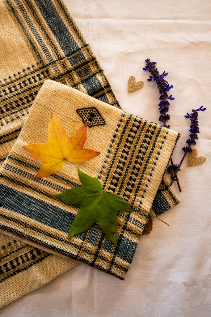 Handwoven Bhujodi Wool Cushion Cover – Natural Ivory with Indigo & Mustard Motifs