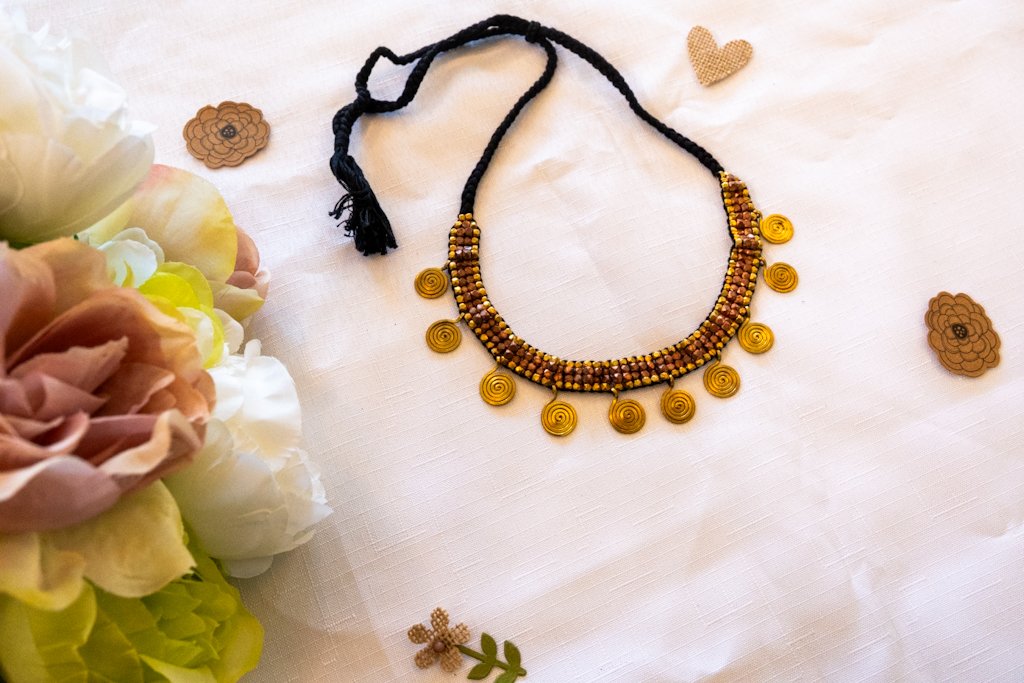 Handmade Dhokra Spiral Disc Necklace – Brass Beads on Black Cord