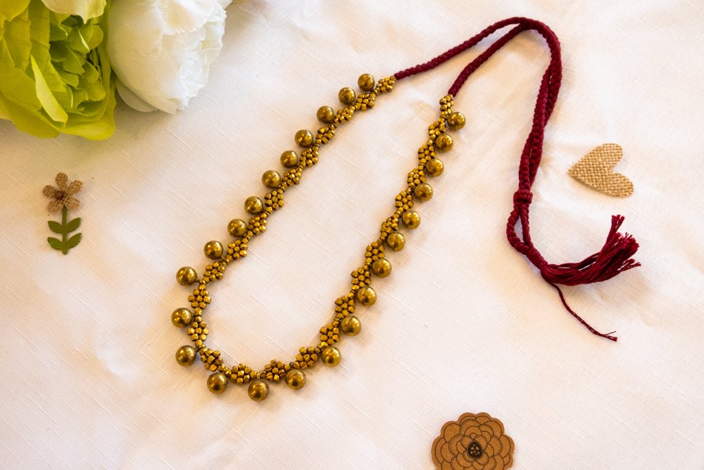 Handmade Dhokra Brass Ball Necklace – Woven Maroon Cord