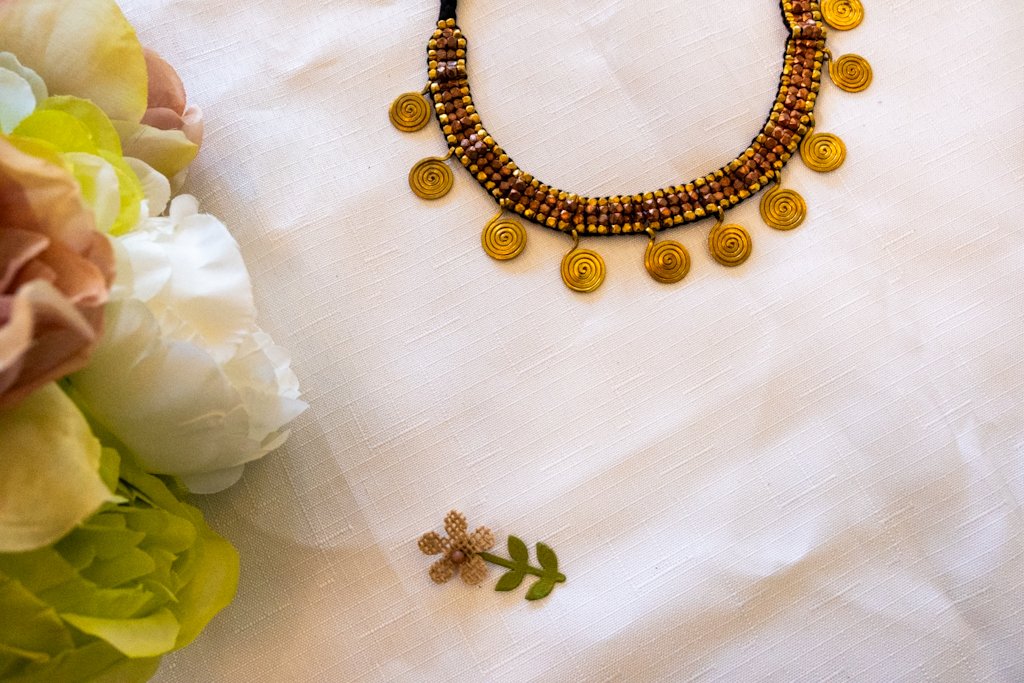 Handmade Dhokra Spiral Disc Necklace – Brass Beads on Black Cord