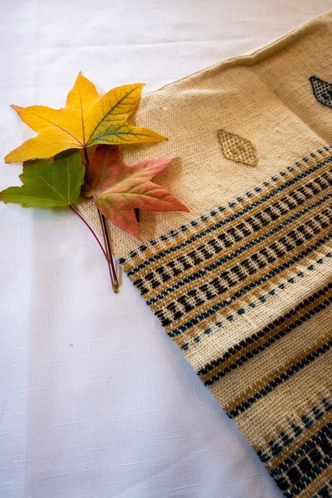 Handwoven Bhujodi Wool Cushion Cover – Natural Ivory with Indigo & Mustard Motifs