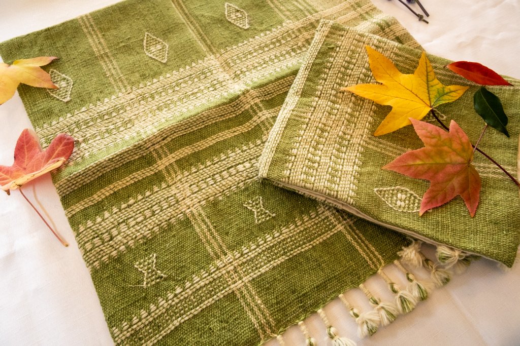 Handwoven Bhujodi Wool Cushion Cover – Sage Green with Ivory Motifs & Tassels