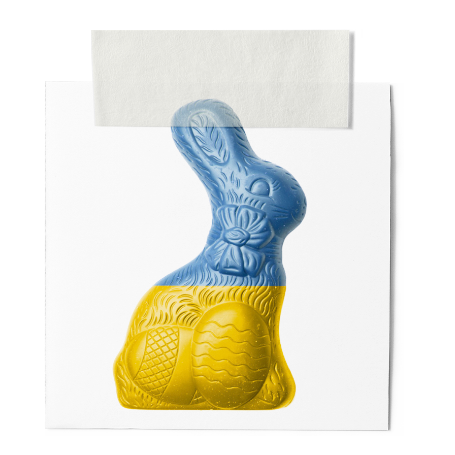 A colorful bunny-shaped chocolate with a yellow bottom and blue top, featuring textured details and patterns.