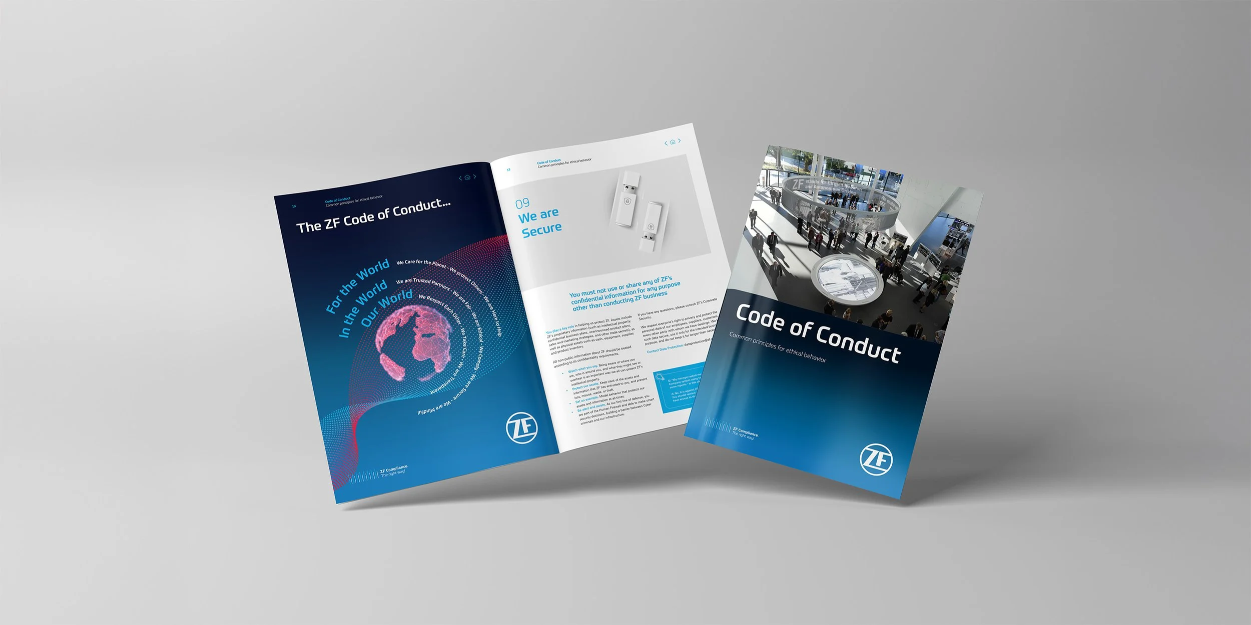 Three ZF company brochures about the company's code of conduct, one open showing internal pages with text and images, and the others closed with blue and black cover designs featuring the ZF logo.
