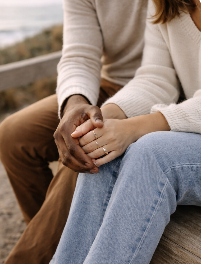 Couples therapy and relationship support in San Clemente, shown through a close-up of a couple holding hands in a calm, connected moment.