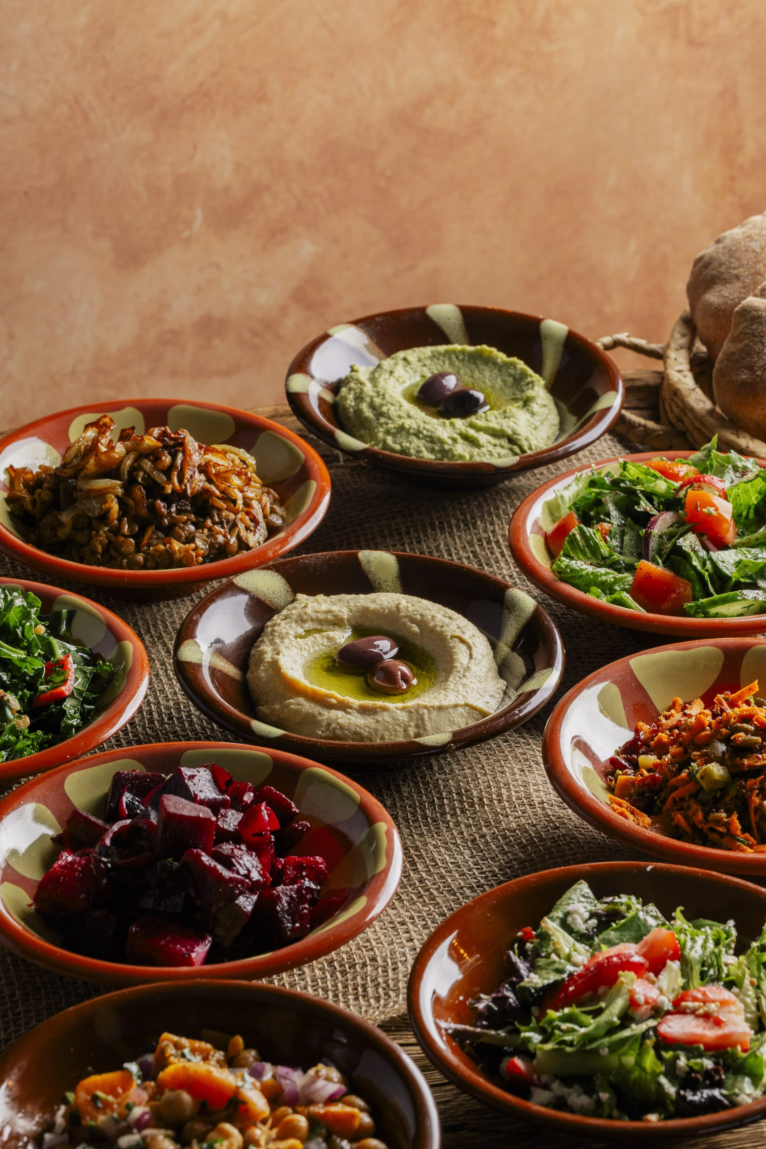 small bowls of various sides & salads