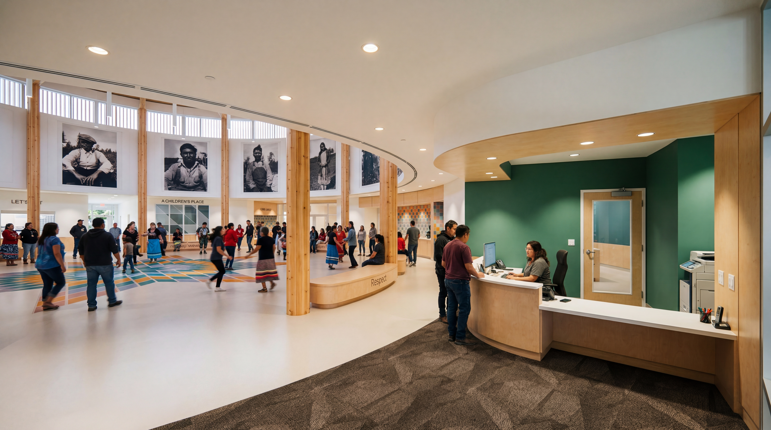 Interior view of a reception area in a public building with a desk, computer, and a chair, green walls, and hardwood accents; in the background, a large open space with black-and-white photos of children displayed on the walls.