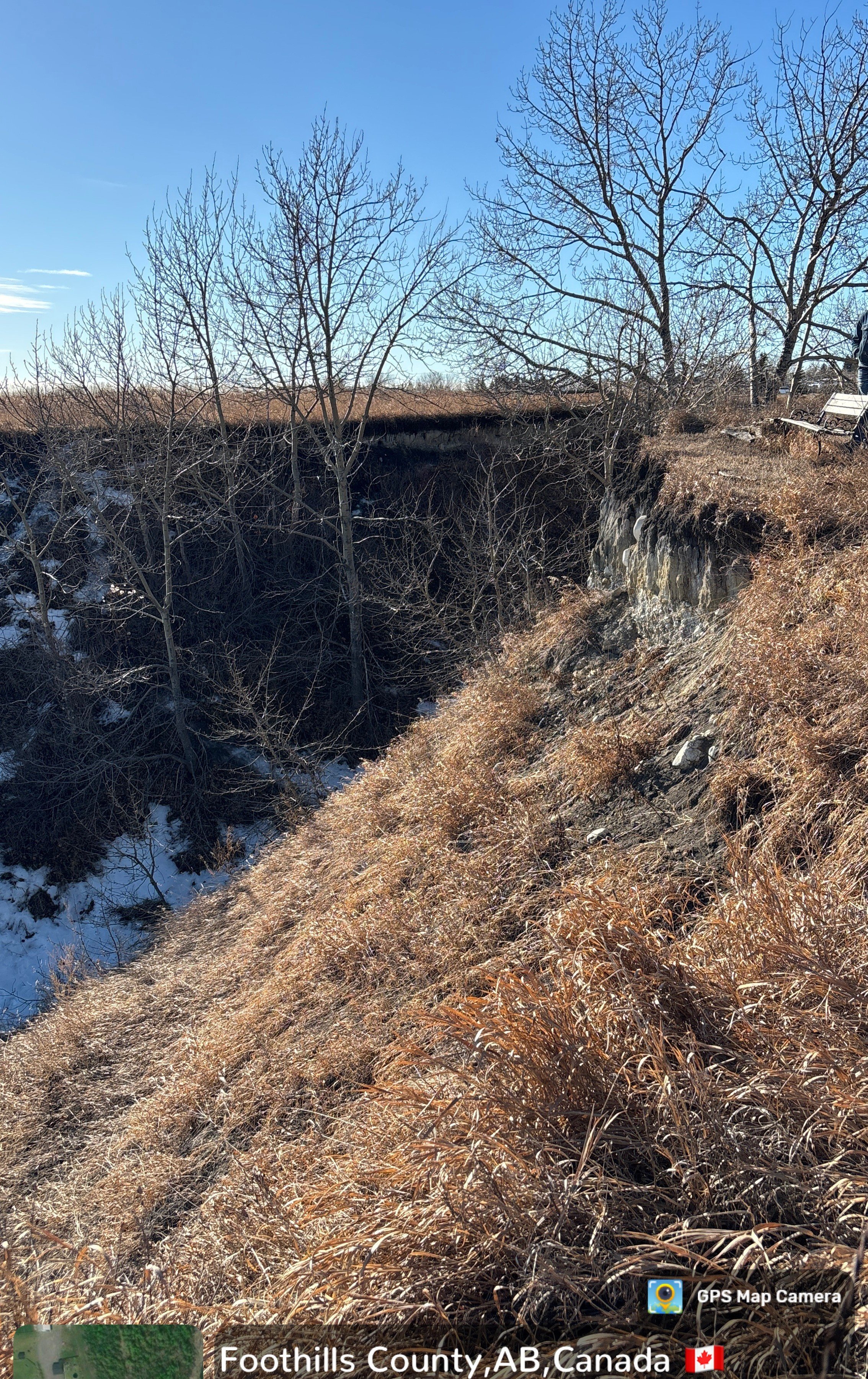 Photo 3 – Exposed Slope Face and Erosion Feature Observed exposed soil/rock face and steep slope geometry reviewed as part of the slope stability screening assessment.