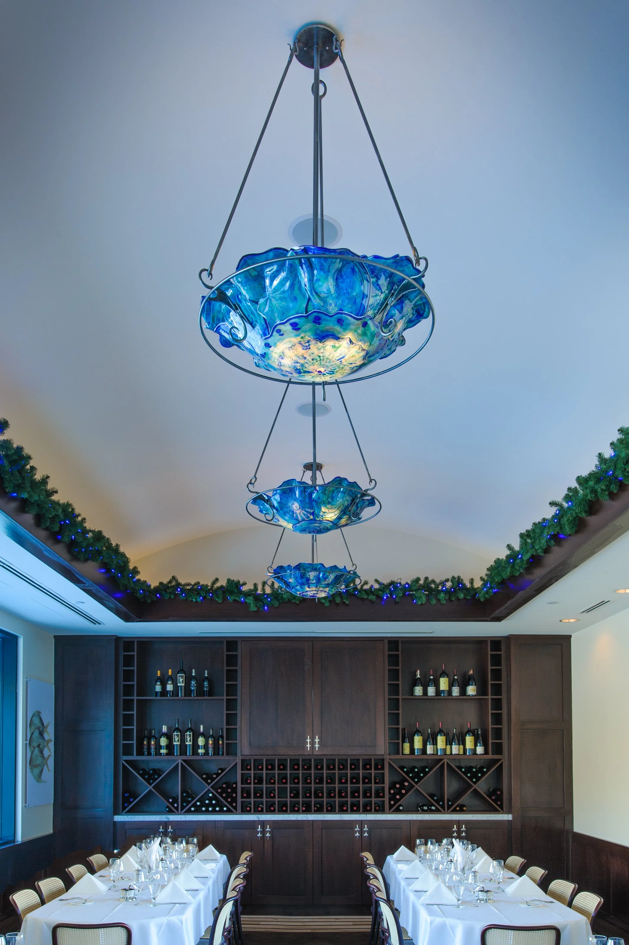 restaurant interior with custom blue glass chandeliers
