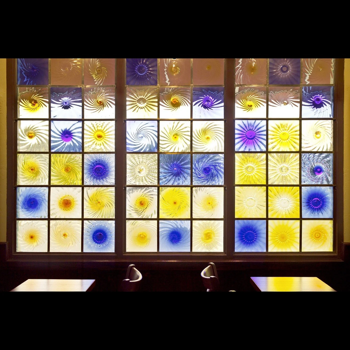 I made this for Jasper's Enoteca. These are blown glass rondels fitted into window panes.