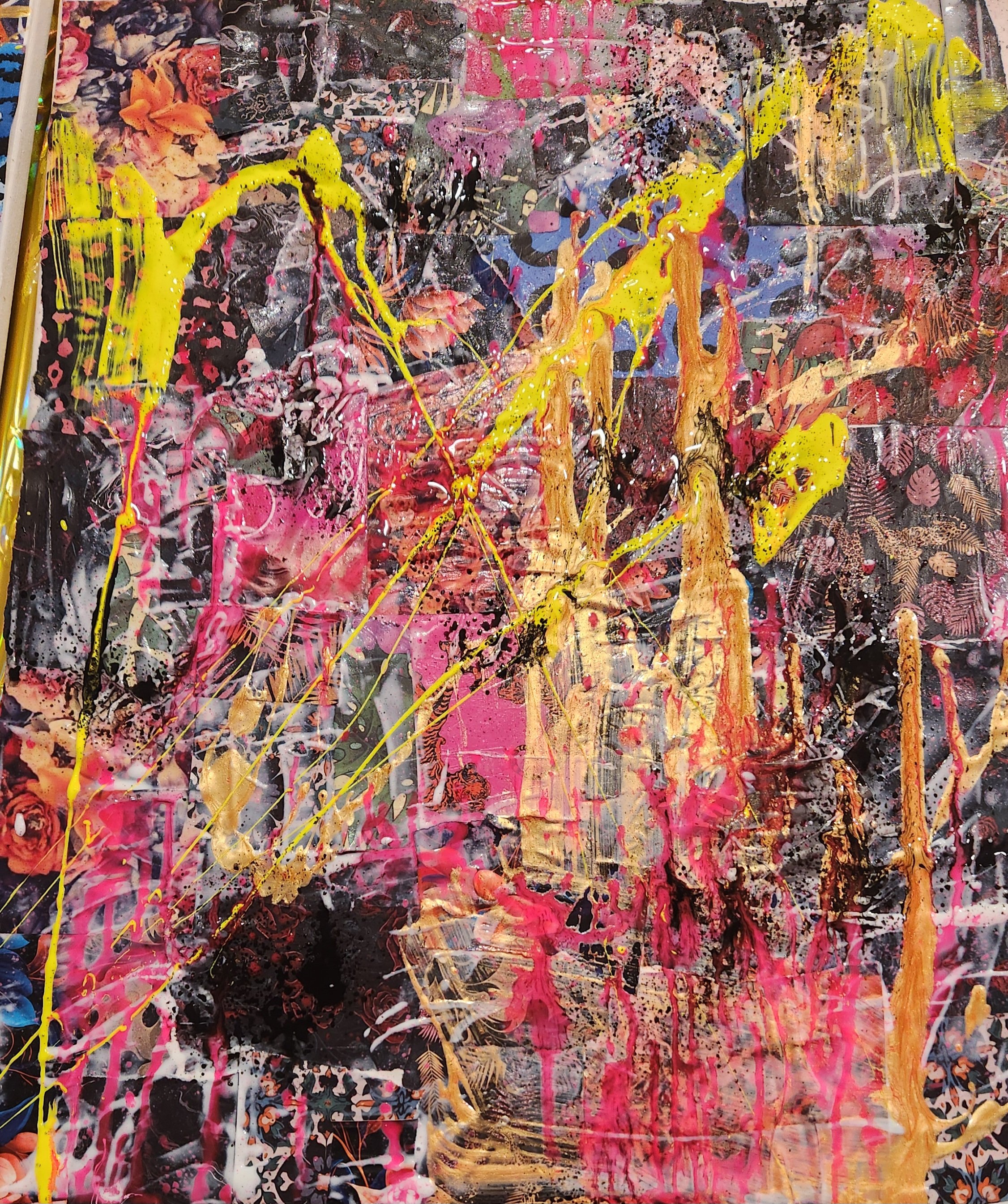 Abstract expressionist painting with splashes and streaks of yellow, pink, orange, black, white, and blue paint on a multi-patterned background.