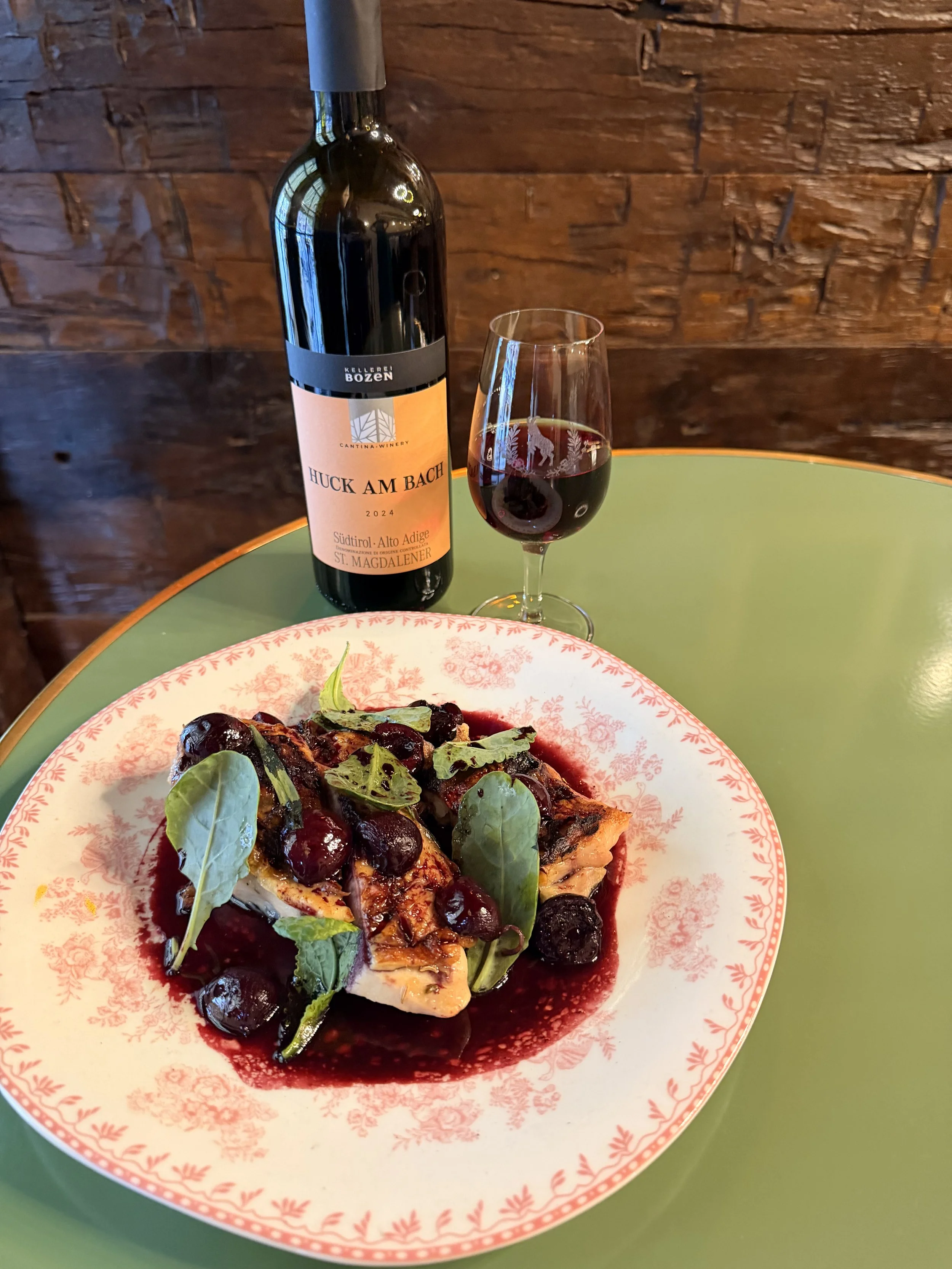 Brick Chicken served with cherry mostarda, sweet cherries, tarragon, and baby kale 
