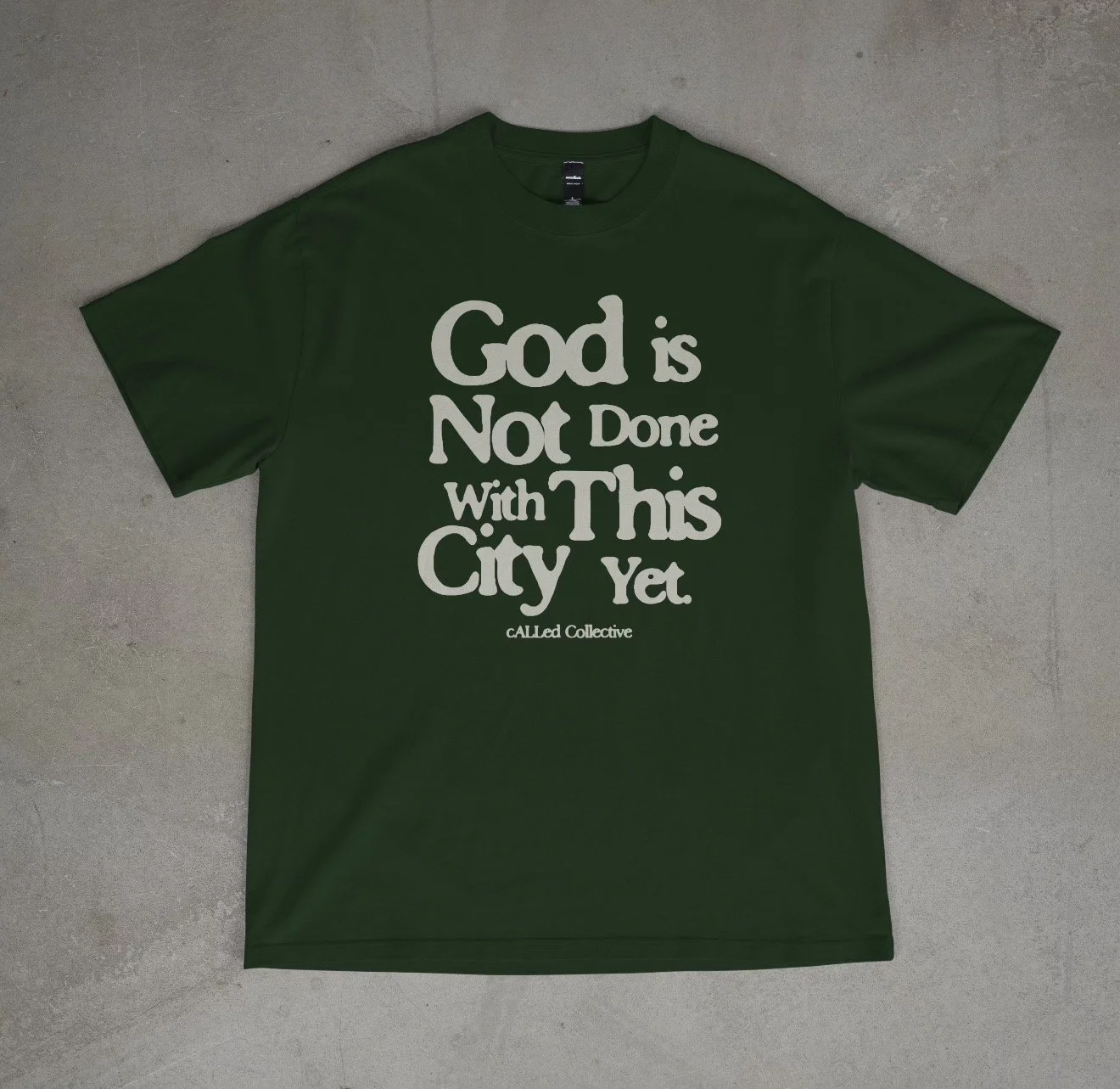 "God is not done with this city yet" heavy t-shirt