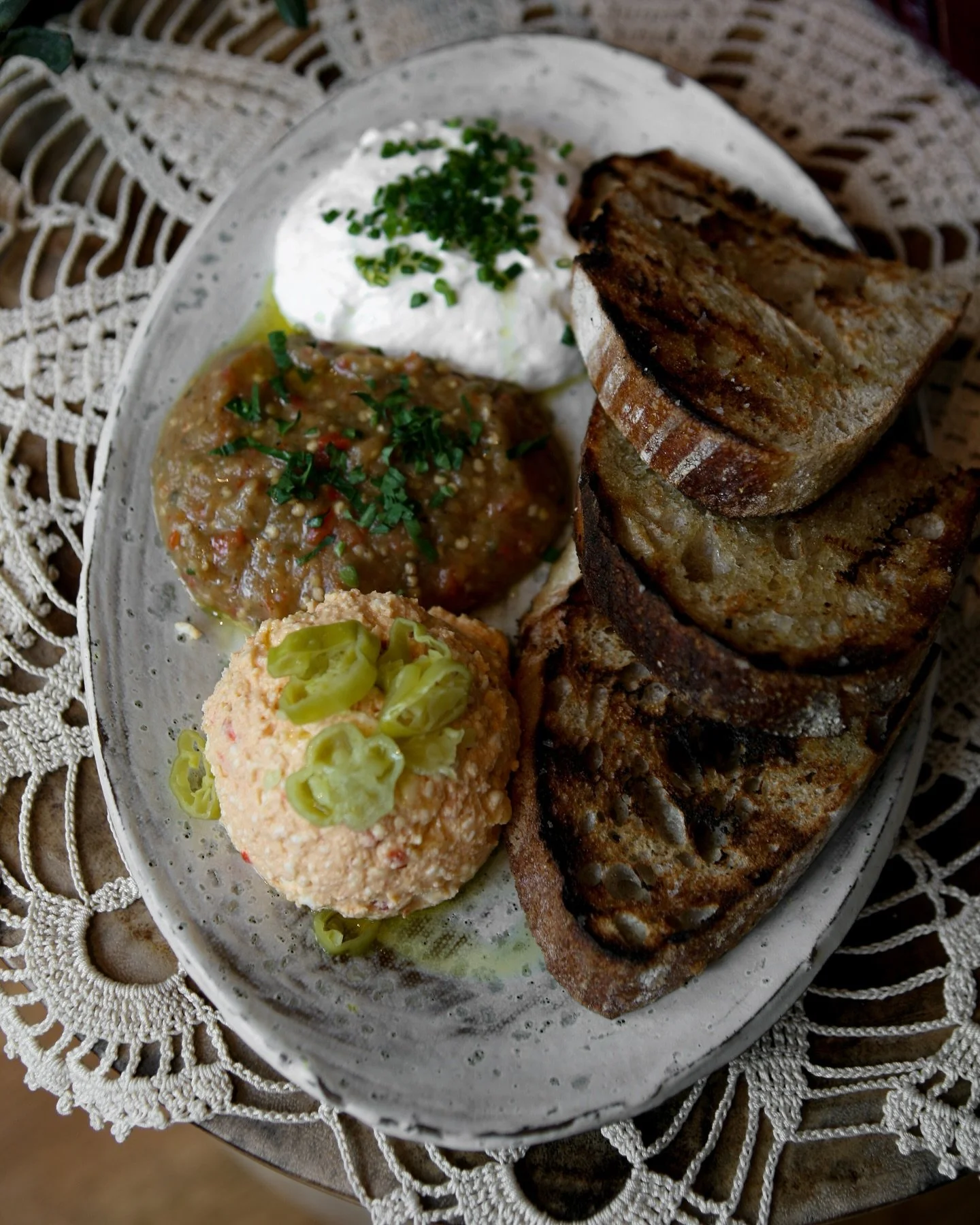 Weekend brunch at Bar Vlaha starts the way all good meals in the villages do&mdash;with bread, dips, and stories waiting to unfold. 

Our dips platter brings together tzatziki, fiery kopanisti, and smoky melitzanosalata, served with warm grilled sour