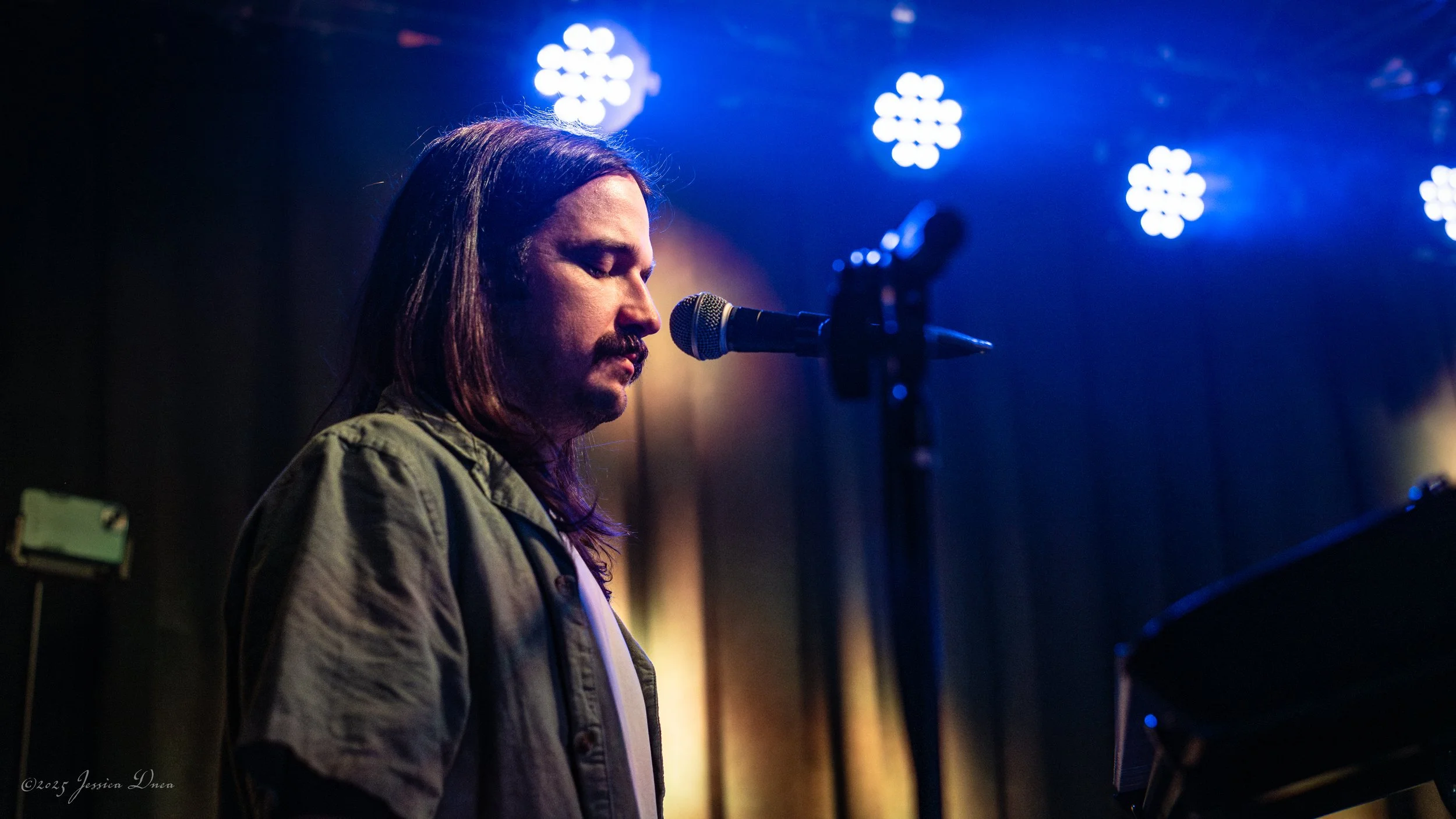 Performance photo captured during a live set in Denver