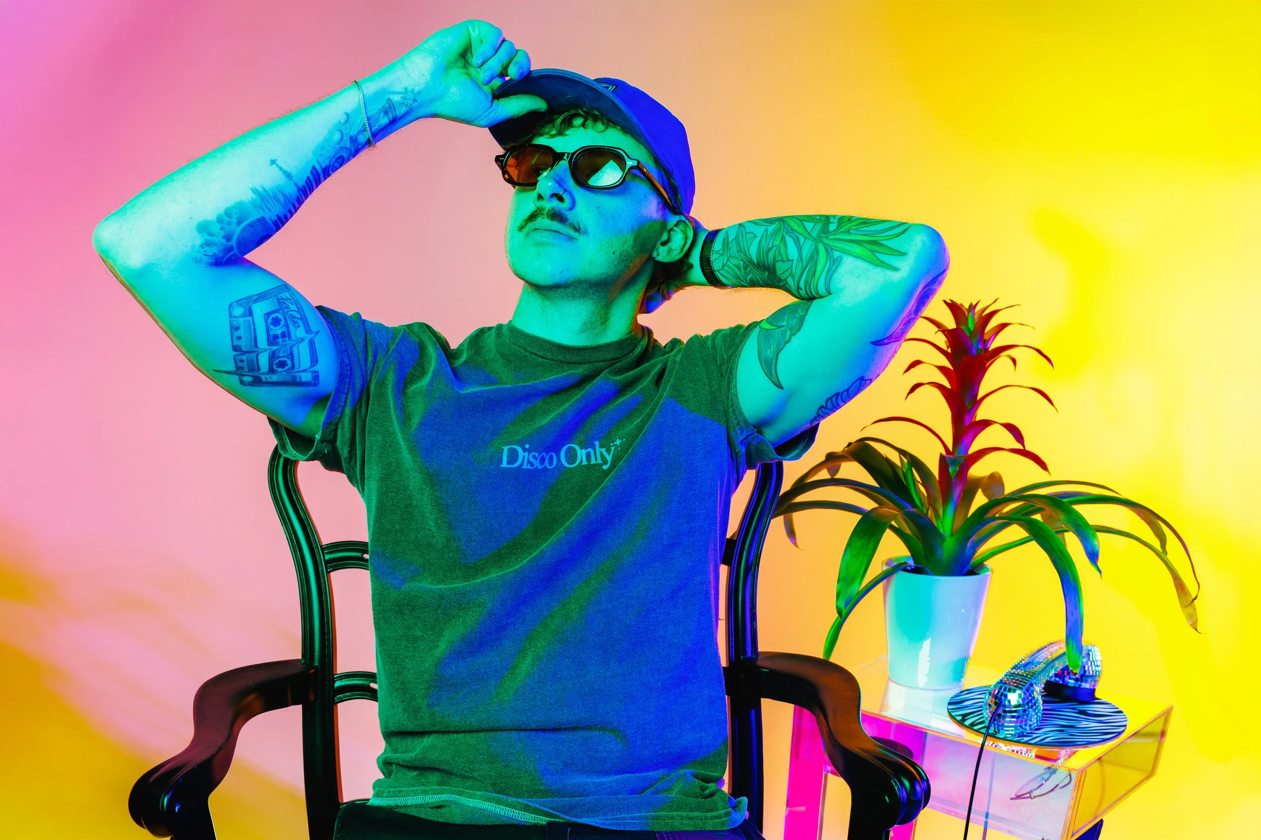 denver-photography-press-studio-pure-colors-adjusting-sunglasses-colorful-background-jessica-dnea-005.jpg