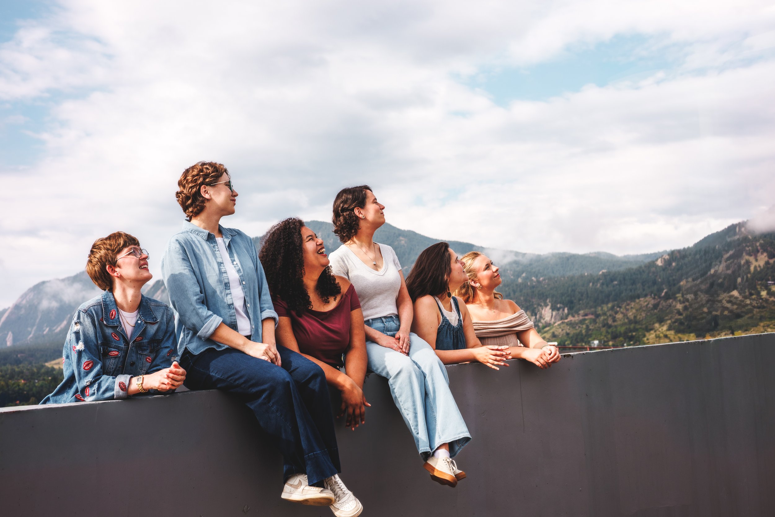 Lyyra press photography in Boulder, Colorado featuring the six-member vocal ensemble with mountain views and natural rooftop light for touring, press, websites, and promotional use.