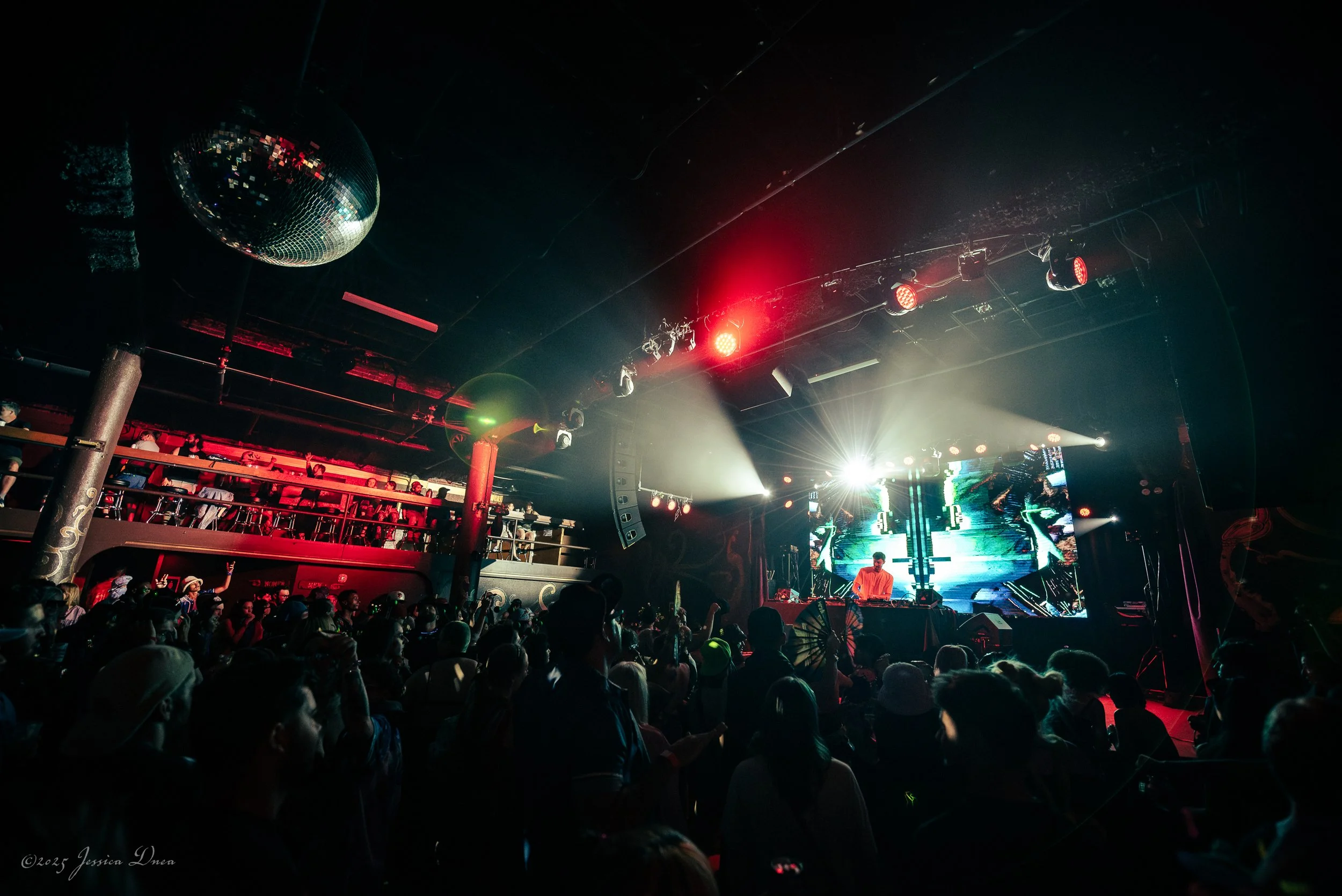Koy.wav performs before a packed Cervantes crowd in a wide Denver concert photo showing the stage, audience and venue atmosphere.