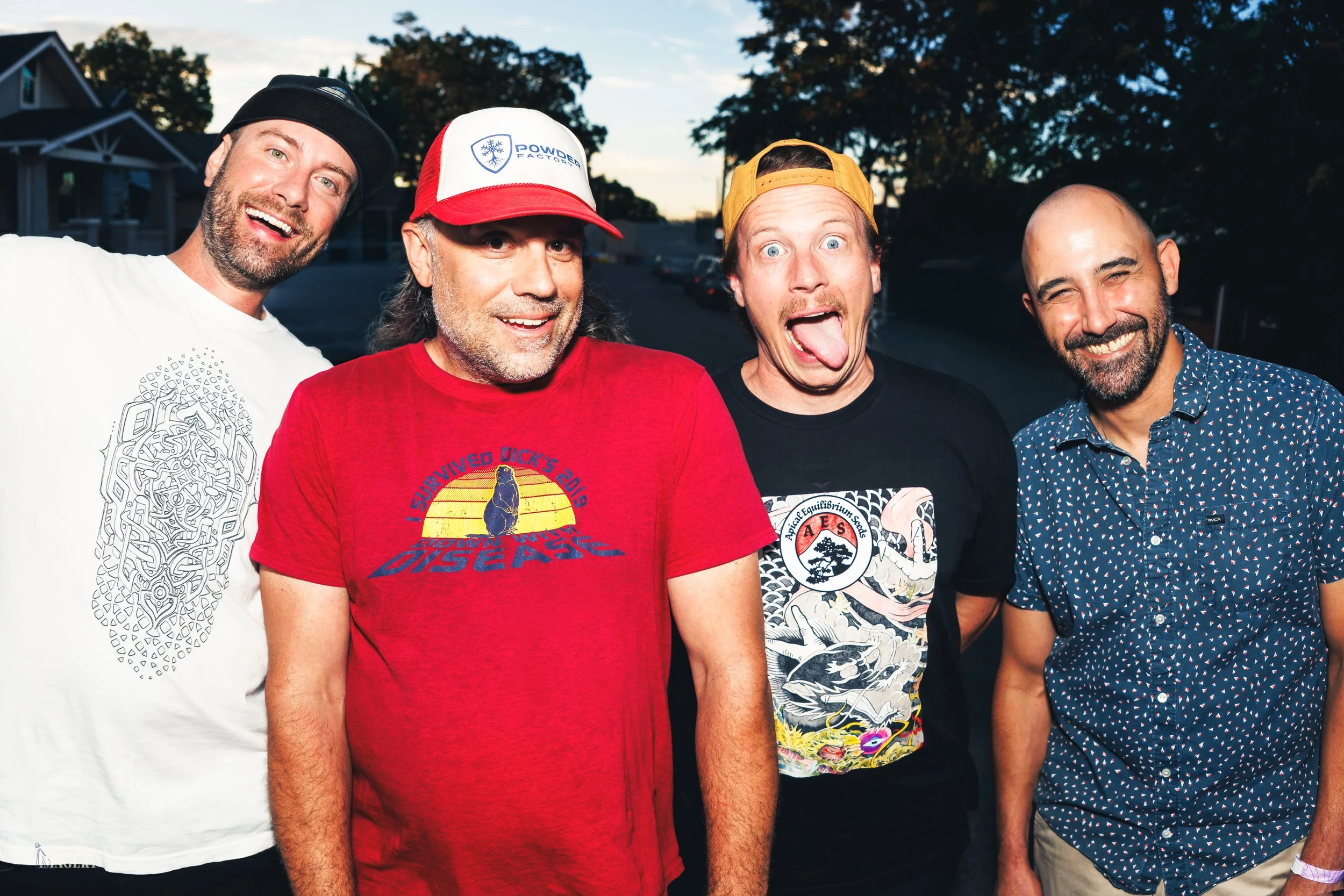 Playful Parky Jobbins  band portrait outside Globe Hall in Denver for concert announcements and show promotion.

