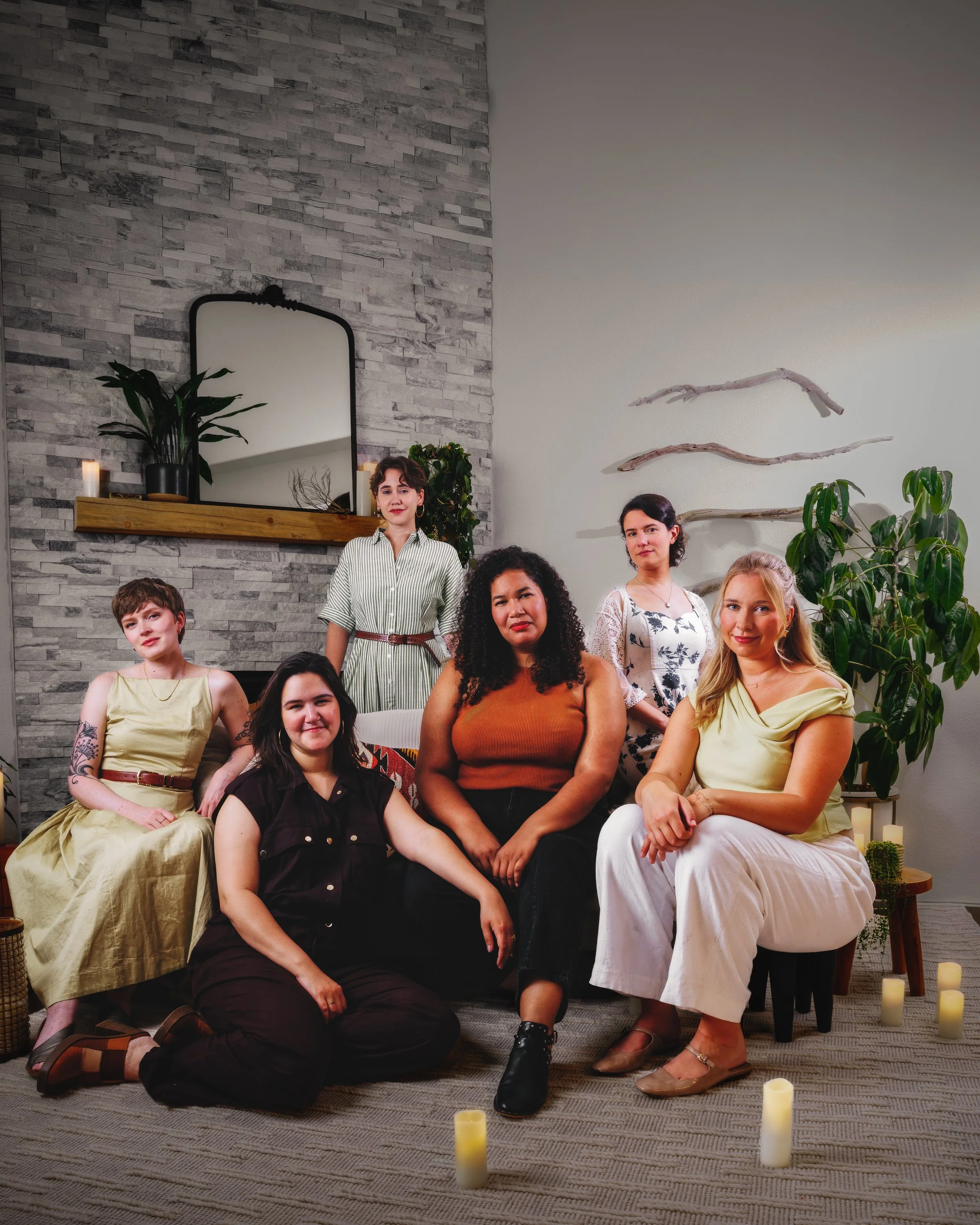 Six-member Lyyra group portrait in a furnished home studio for album promotion, press and EPK use.