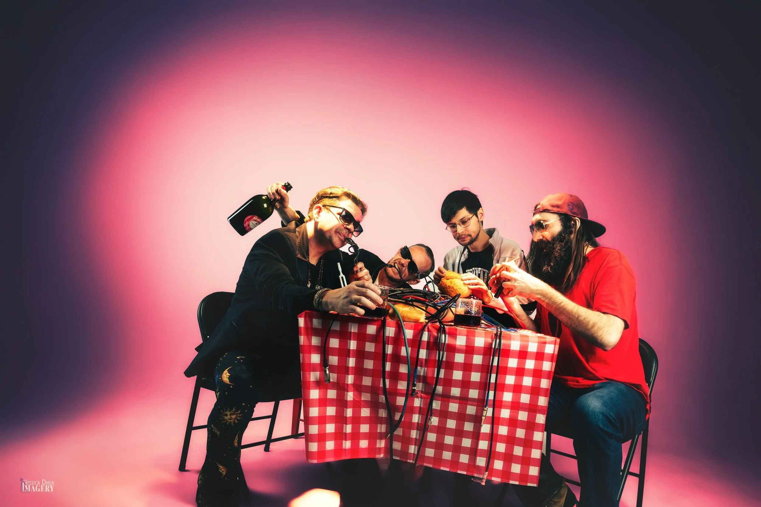 Conceptual band promo photo featuring a client-supplied picnic set, props and colored studio lighting