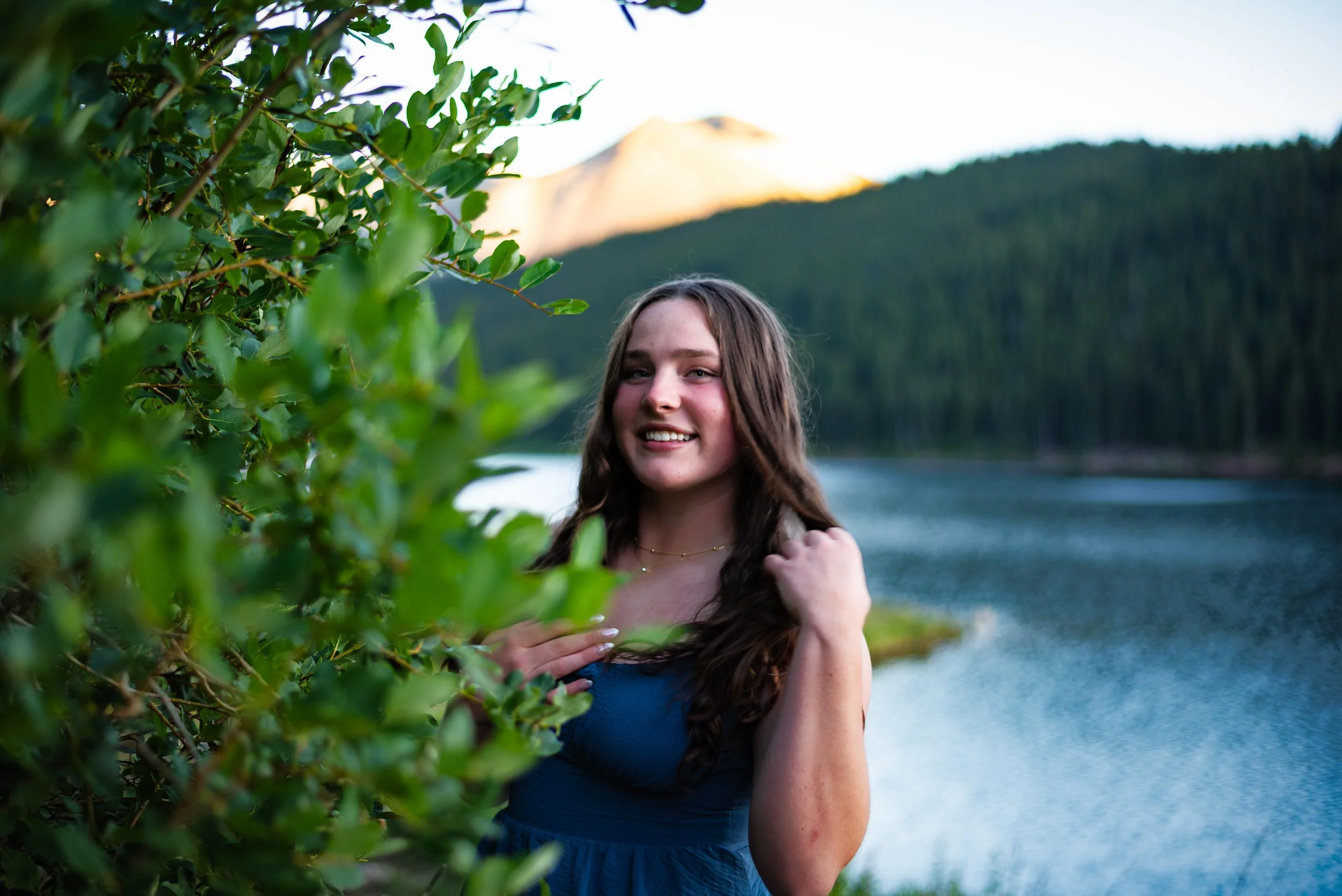Colorado creek and mountain senior photos by Jessica Dnea Imagery with water features, natural scenery, relaxed posing, and outdoor graduation portraits in Colorado.