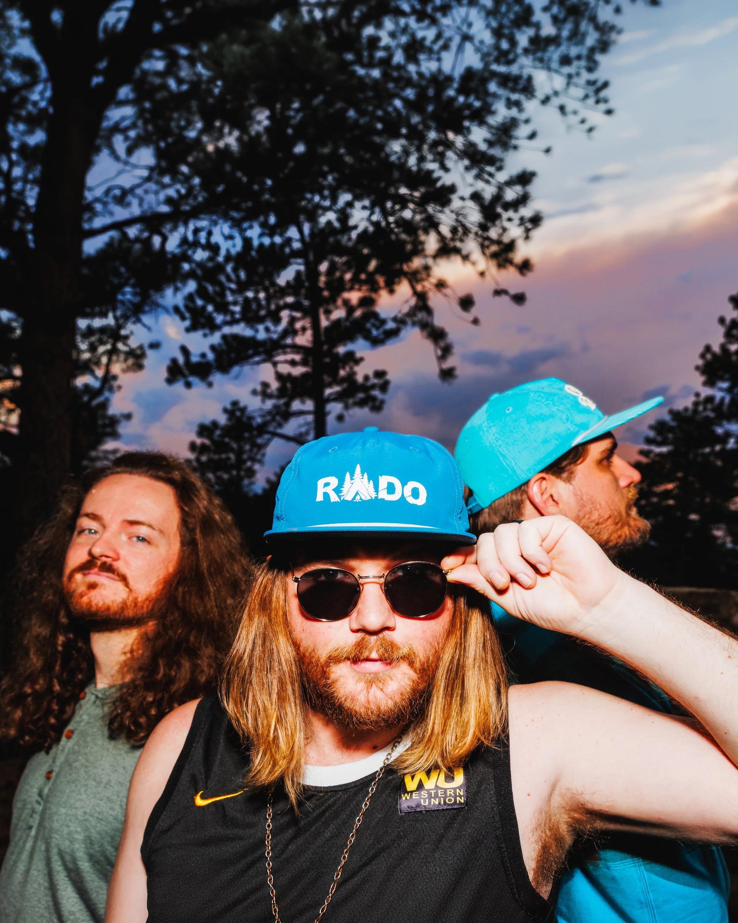 Close editorial band portrait of RADO at sunset during an on-location Colorado press photography session