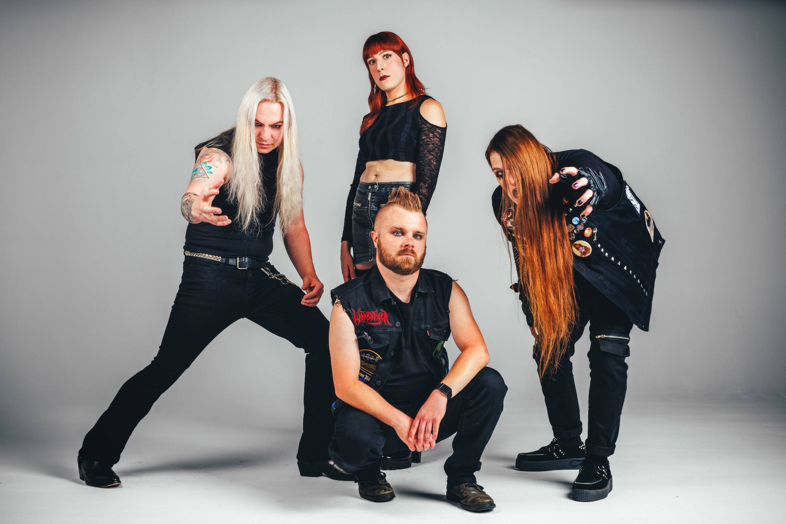 Full-body Celestial Wizard band promo image with dramatic posing on a seamless white studio background.