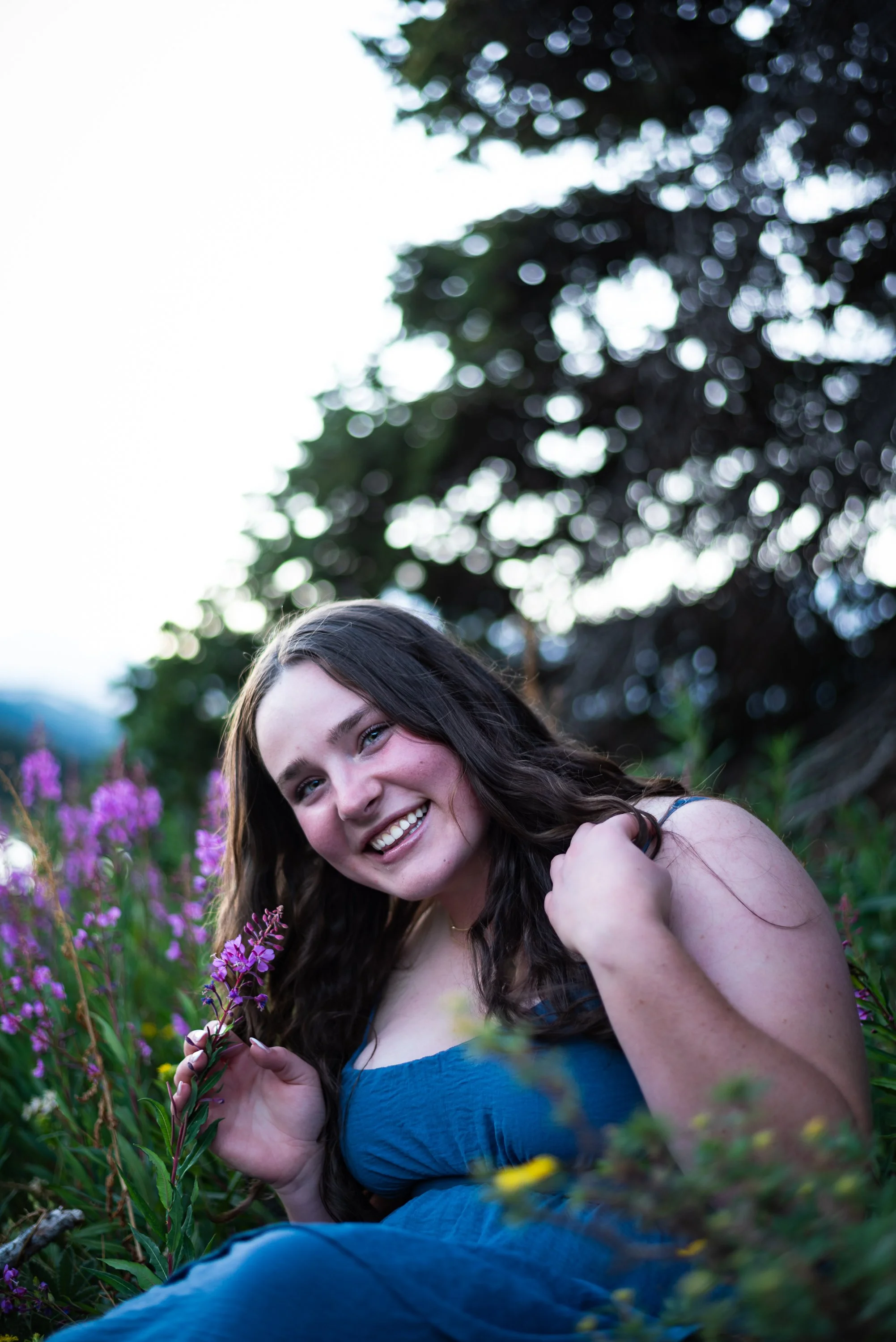 Outdoor senior portrait session in the Colorado mountains by Jessica Dnea Imagery with open sky, natural scenery, water features, and easy portrait direction.
