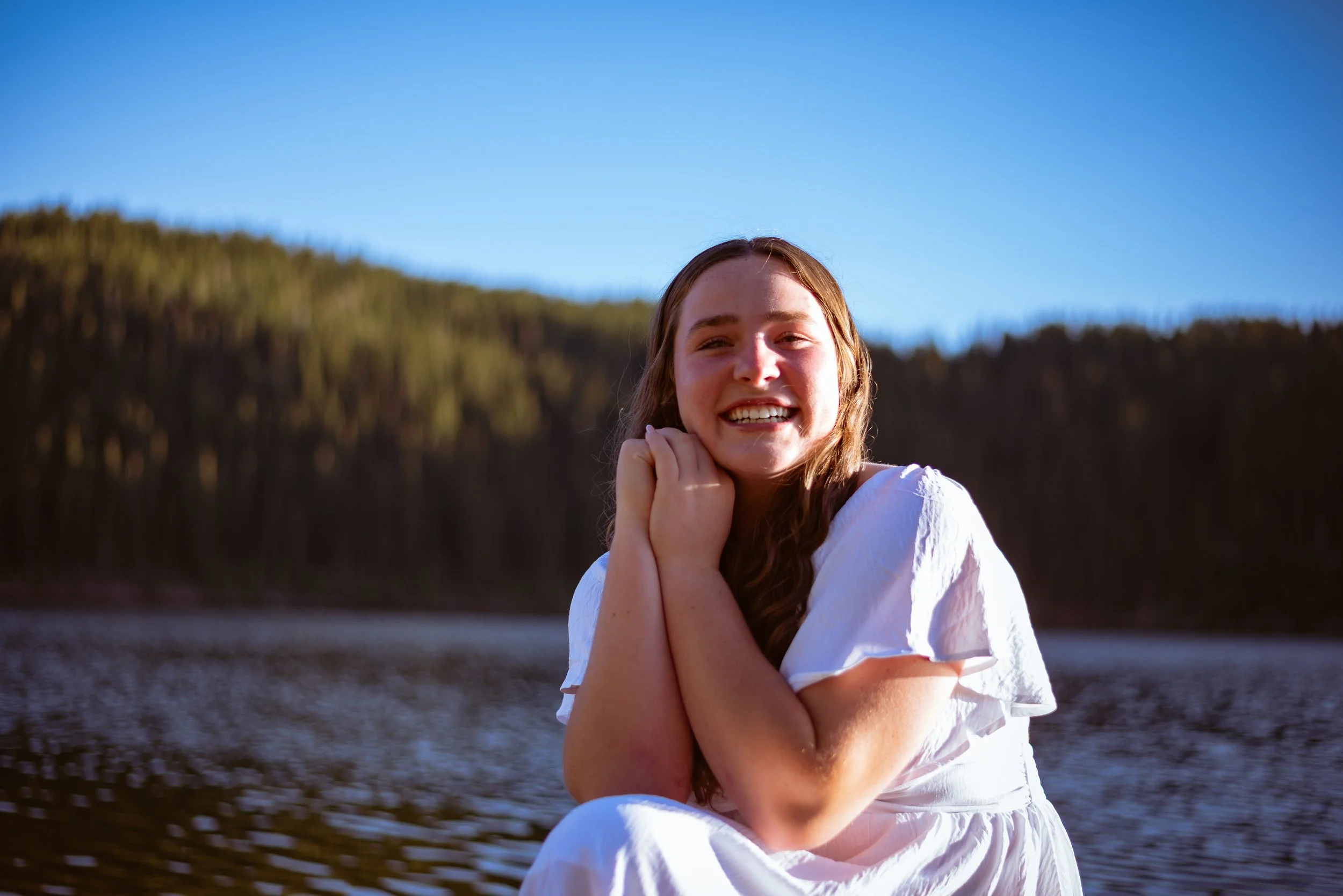 Colorado alpine senior and graduation portraits by Jessica Dnea Imagery with dramatic mountain views, outdoor light, personal style, and edited high-resolution images.