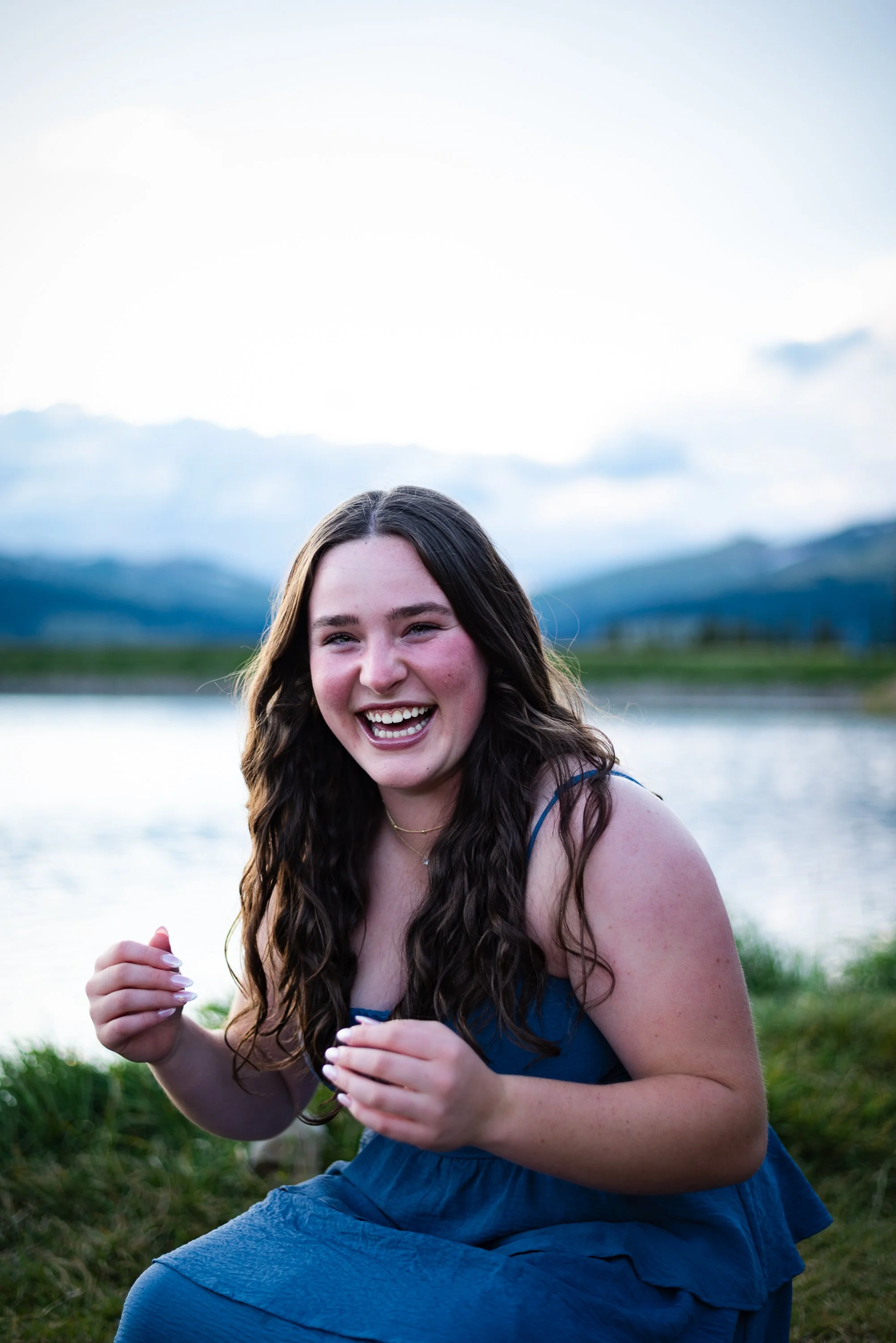 Mountain senior photos in Colorado by Jessica Dnea Imagery featuring water, rocks, pine trees, soft evening light, and natural outdoor portraits for graduation season.