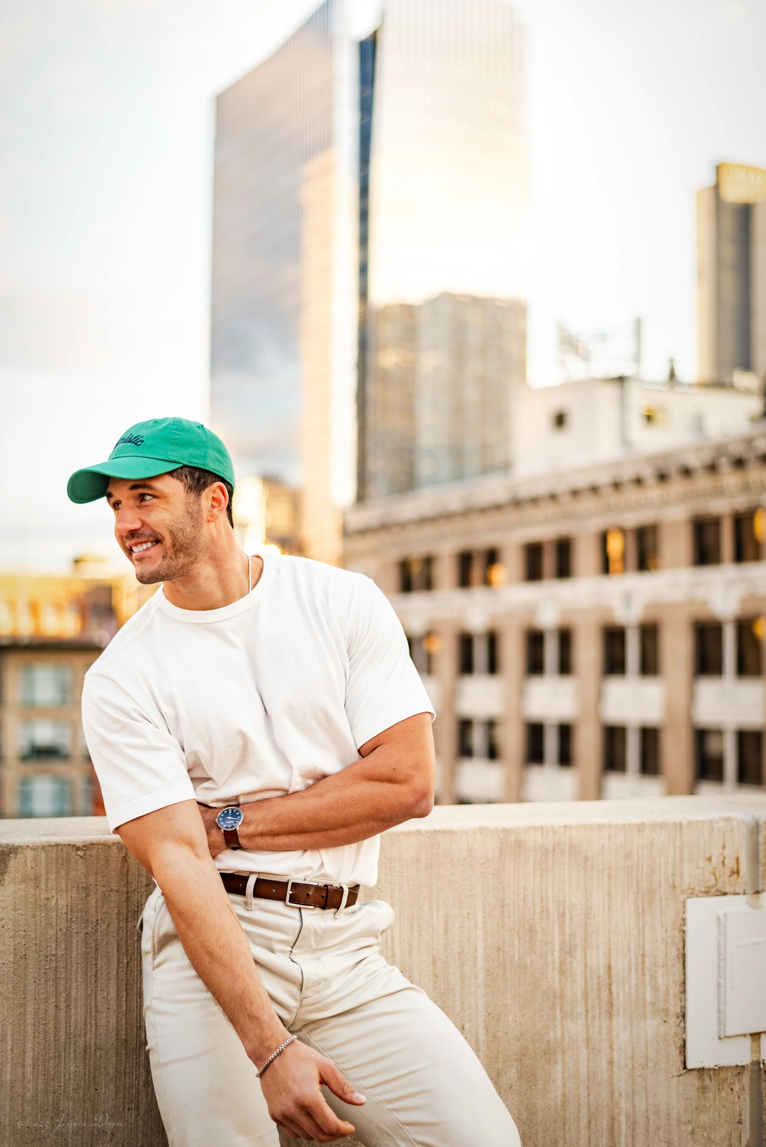 Downtown Denver lifestyle portrait with warm natural light, city architecture, relaxed posing, and a clean professional look for personal branding, websites, profiles, and social media.