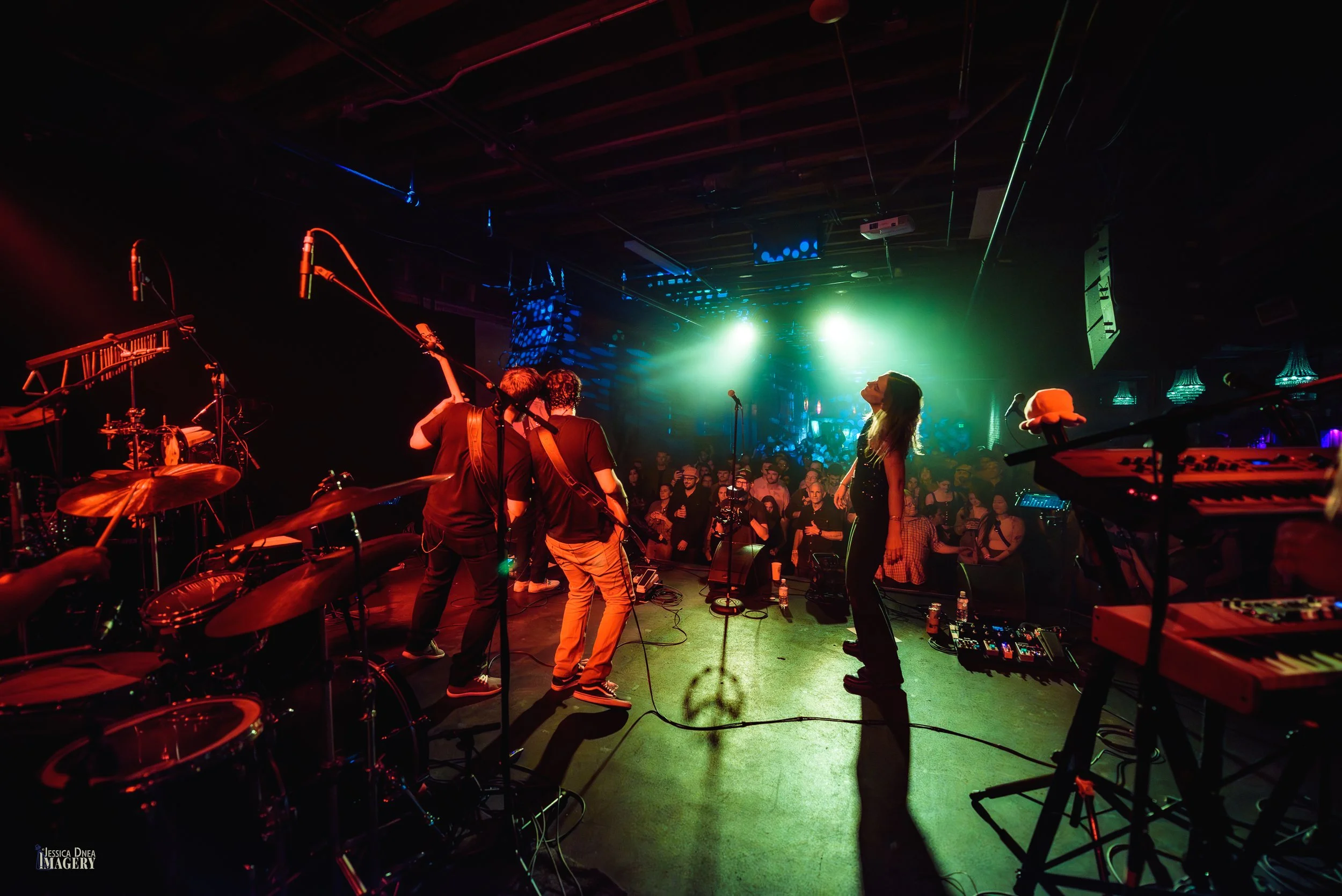 The Hip Snacks perform for a packed Cervantes audience in a wide stage-to-crowd view by Denver concert photographer Jessica Dnea.