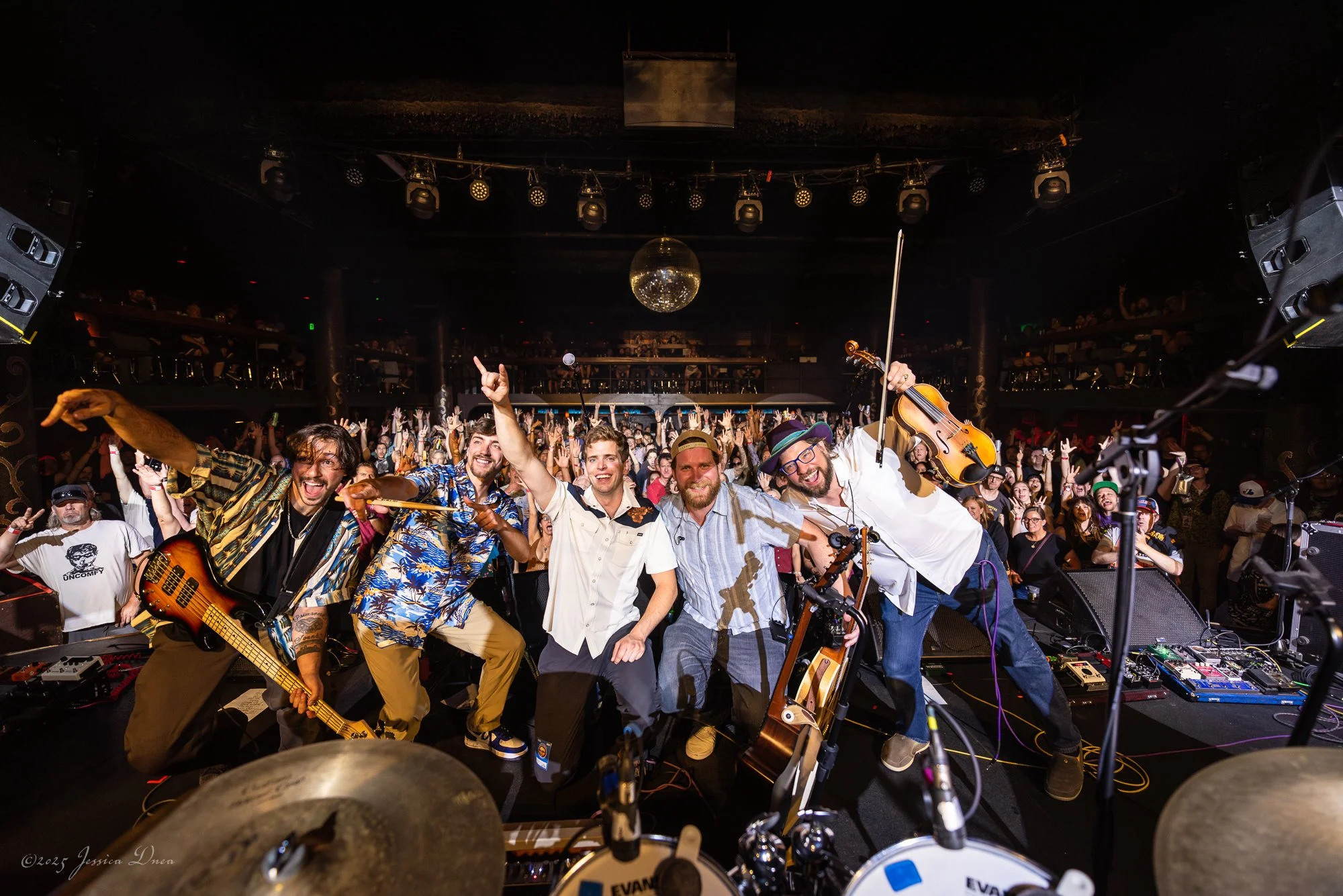 The Ridgeliners and Cervantes audience celebrate together in a wide concert photo captured from behind the drum kit in Denver.