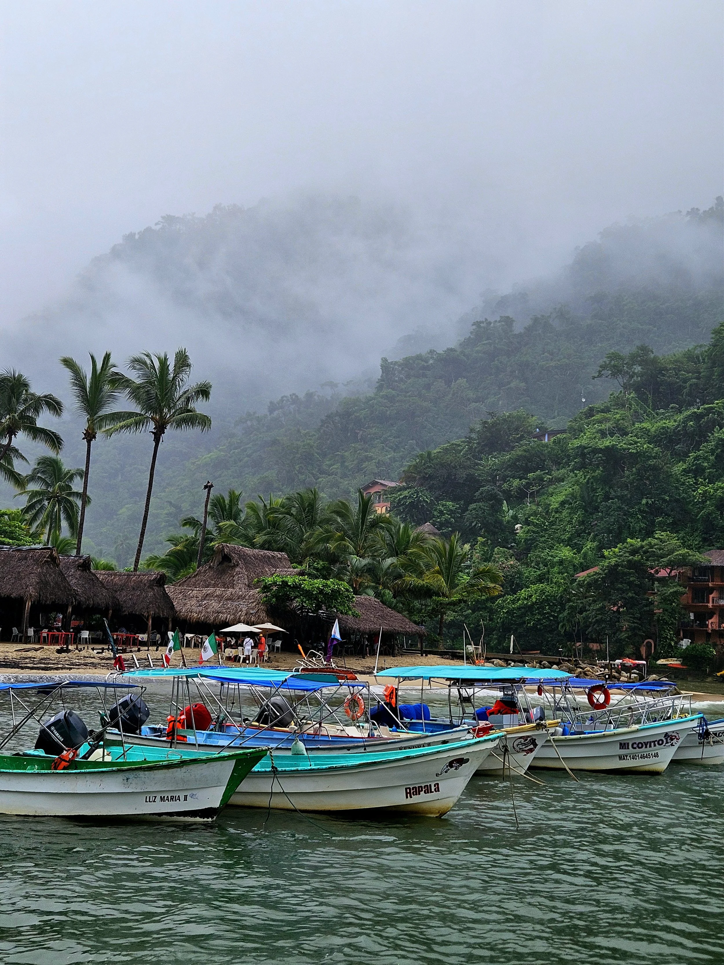 Couple taking a water taxi across the ocean to yelapa beach