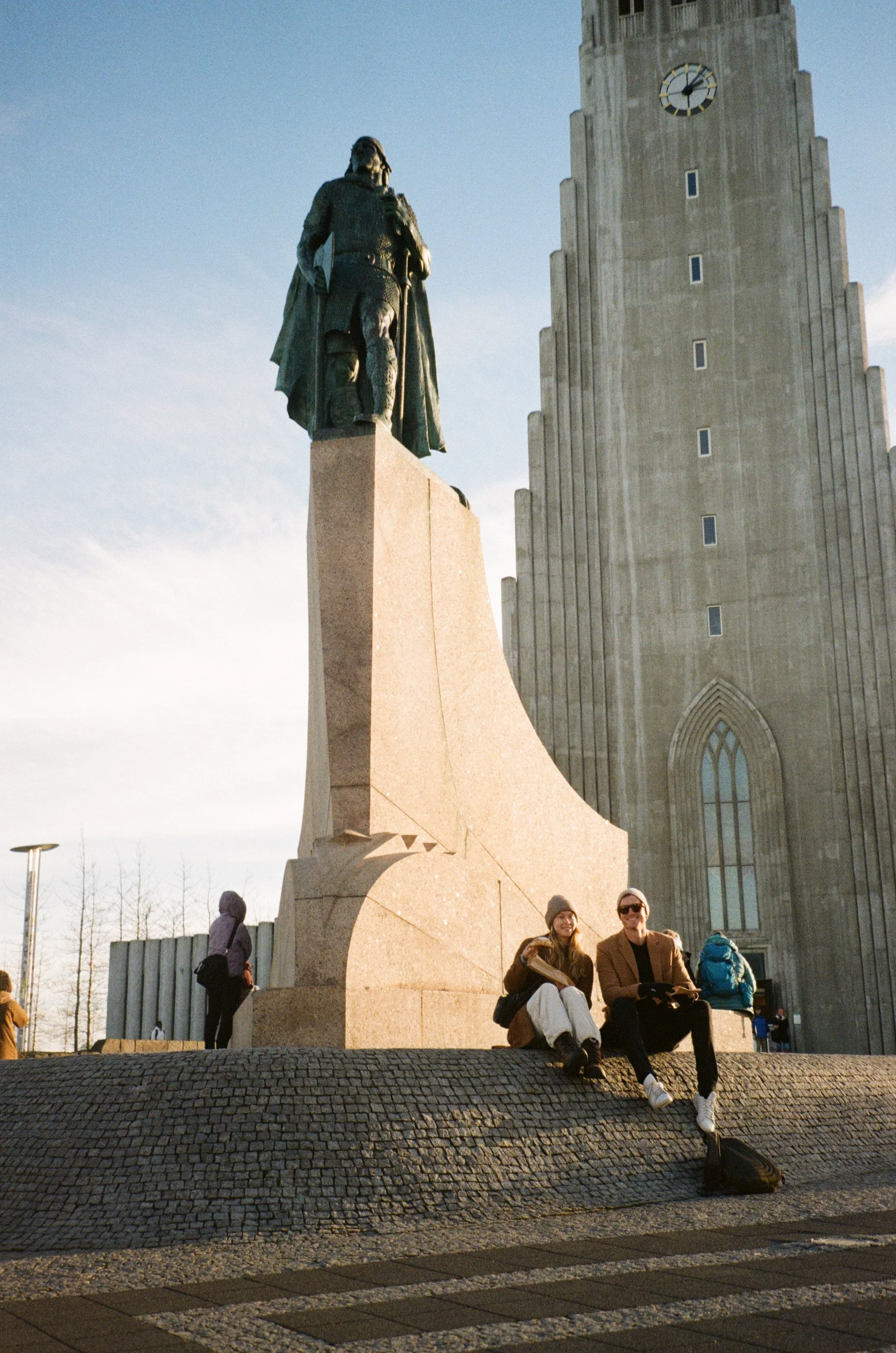Enjoying fresh cinnamon buns in front of the Hallgrímskirkja church
