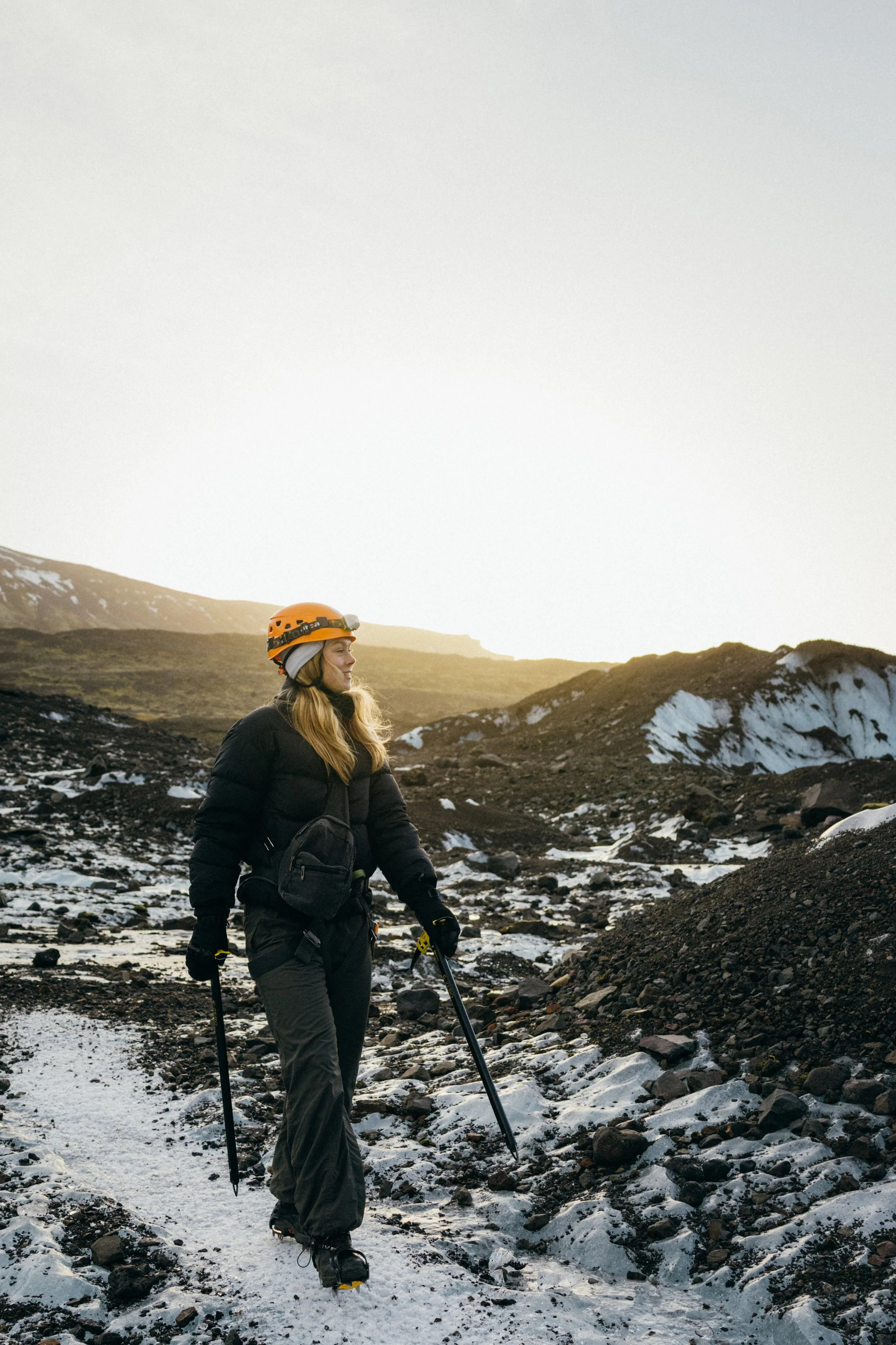 Sunrise peeking over the mountains as we hike onto the glacier in Iceland