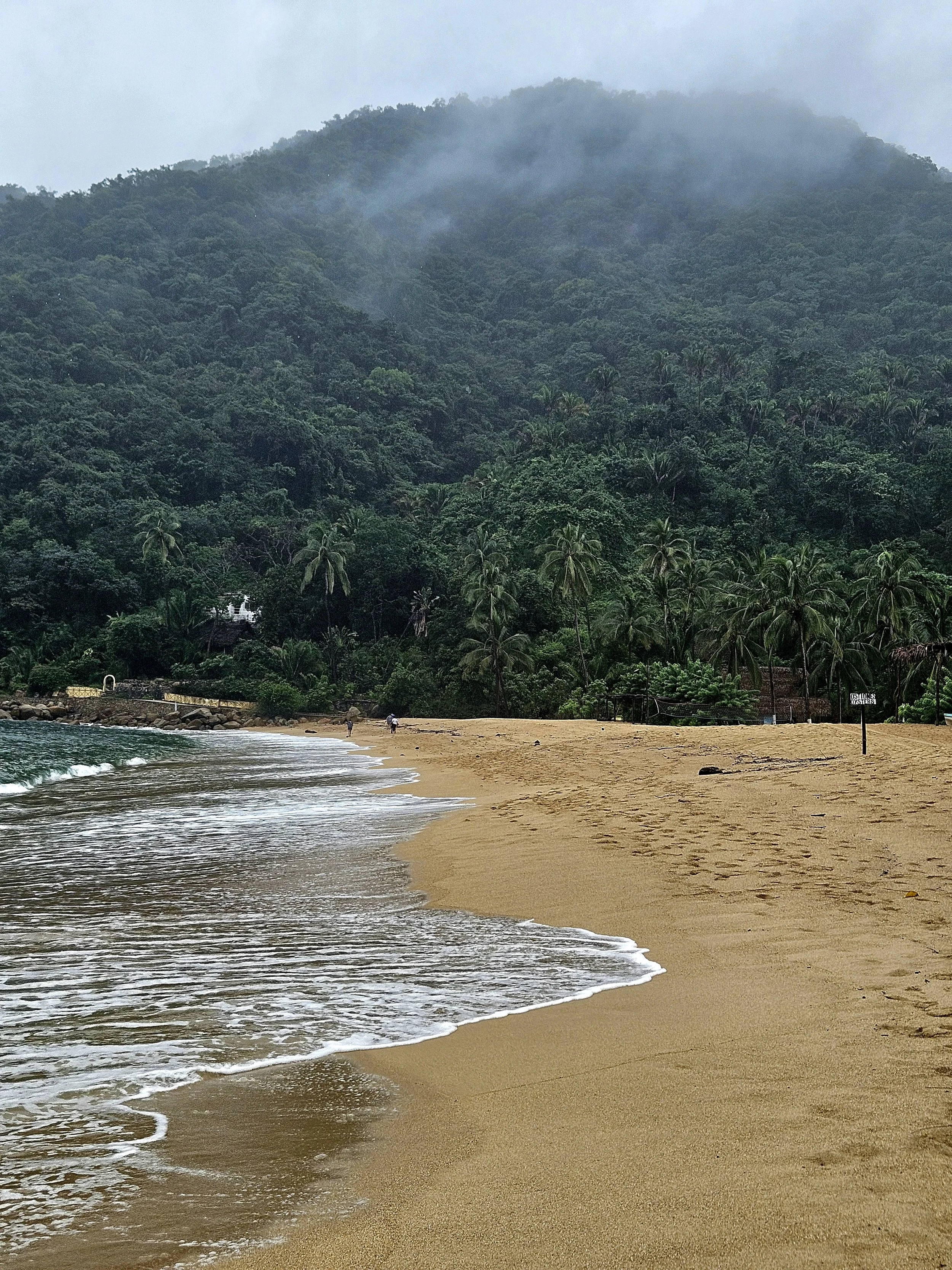 Tropical beach and village coastlineon a rainy day in Yelapa Mexico
