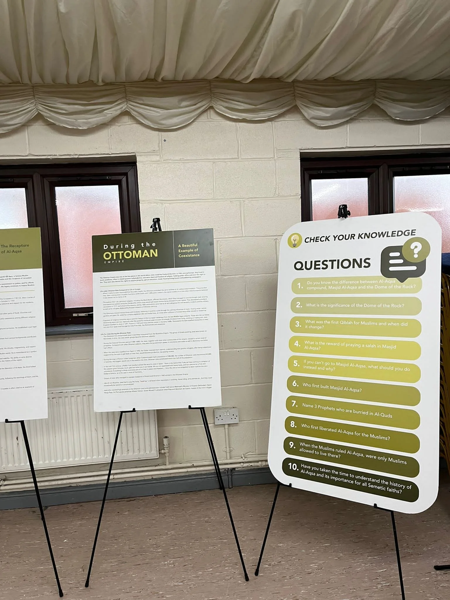 Educational display with questions about the history of Al-Aqsa Mosque and its significance.