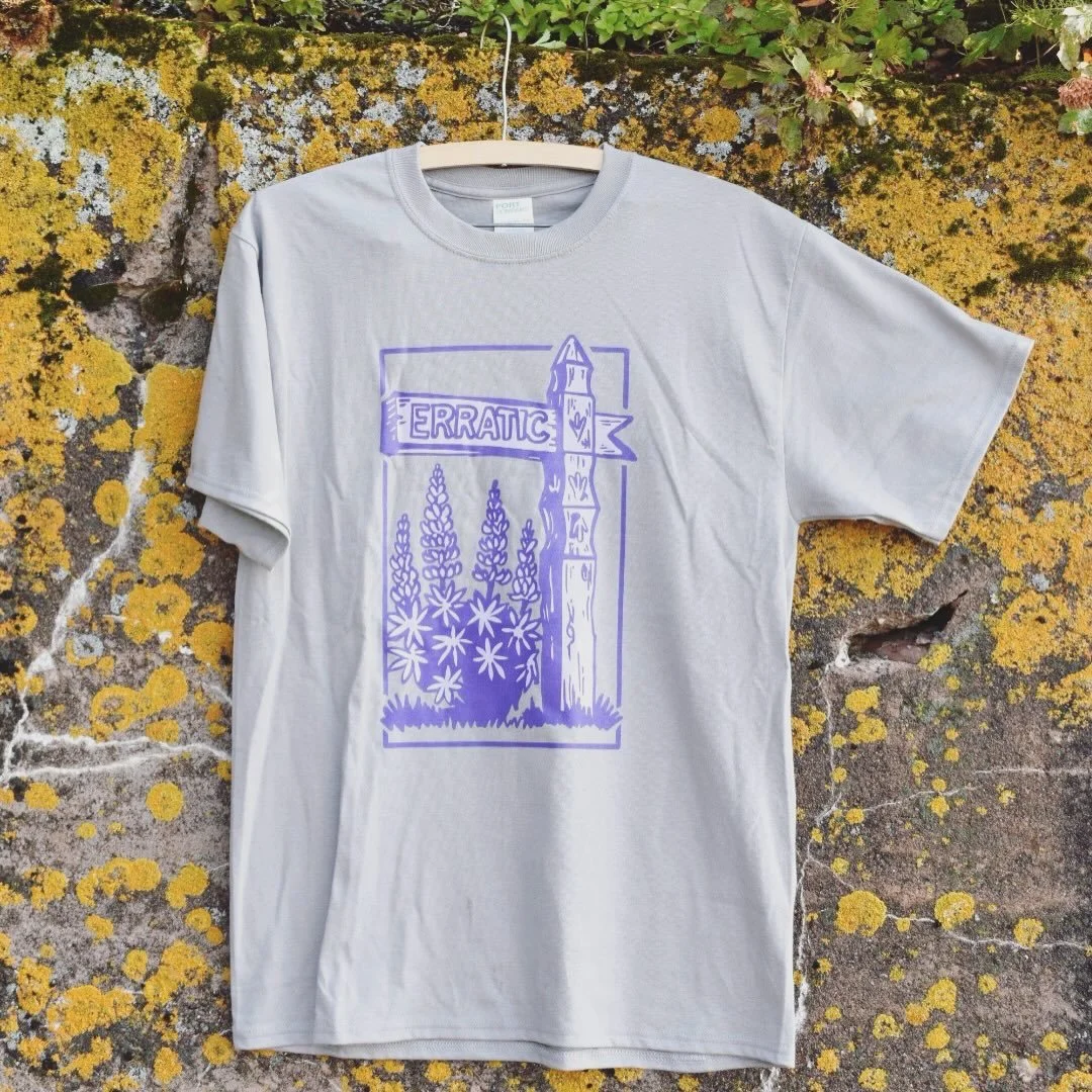 An Ode to Cascade Beach Road
.
A celebration of summertime, north shore lupine, and a nod to Edwin Lundie&rsquo;s design style scattered along Cascade Beach Road. We are excited to share our very first piece of Erratic Coffee Basecamp merchandise in 