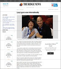 Screenshot of a news website titled The Ridge News with an article about local games becoming internationally recognized, featuring a photo of two smiling individuals, a woman and a man, sitting together.