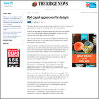 Screenshot of a news article from The Ridge News titled 'Red carpet appearance for designs', with advertisements on the right side, including one for holiday deals and a lottery promotion.
