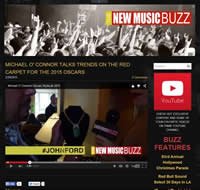 Screenshot of a webpage featuring entertainment news, highlighting music buzz, a video player, and upcoming event details.