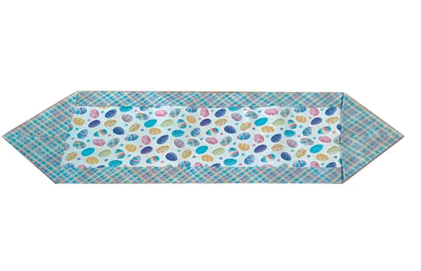 Serger sewing class project example featuring a colorful fabric table runner with patterned center and decorative border