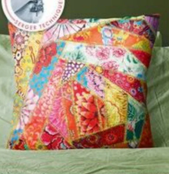 Serger crazy pillow project featuring vibrant patchwork fabric stitched in a spiral pattern using decorative serger techniques