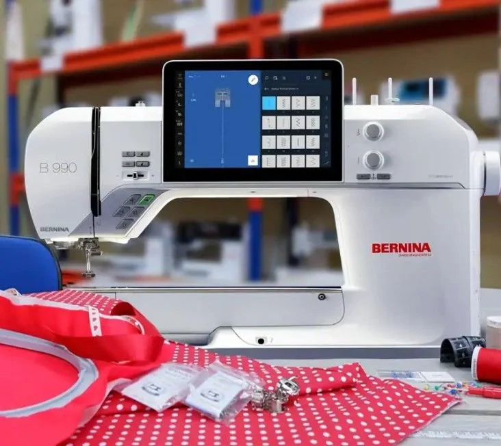 Bernina 990 sewing machine with fabric and tools ready for a sewing retreat or workshop