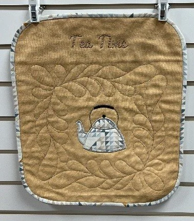 Bernina CutWork Tool project featuring a quilted teapot applique with decorative stitching created using embroidery software