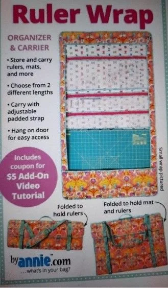Ruler Wrap by Annie sewing pattern cover showing an open fabric ruler organizer with colorful patterned sections, storage pockets, and quilting rulers.